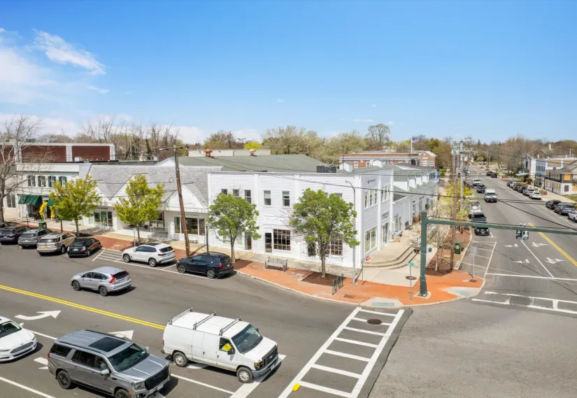 a view of a city street with cars