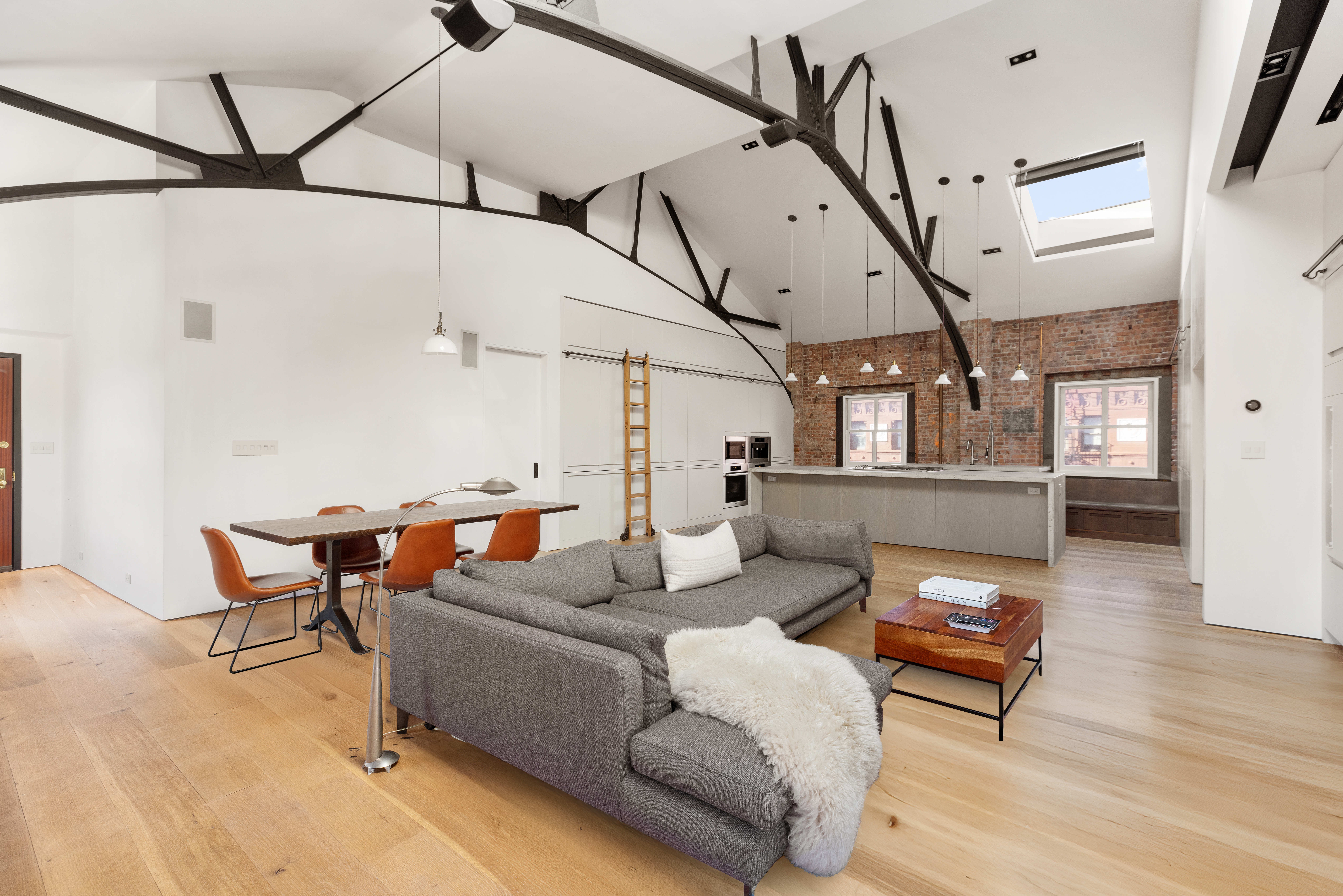 240 Centre Street, Unit 6N Manhattan, NY 10013 - Photo 5 of 16 a living room with furniture and wooden floor
