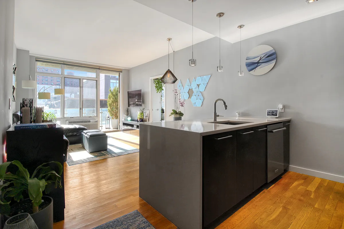 342 East 110th Street, Unit 5E Manhattan, NY 10029 - Photo 4 of 18 a kitchen with a table and chairs