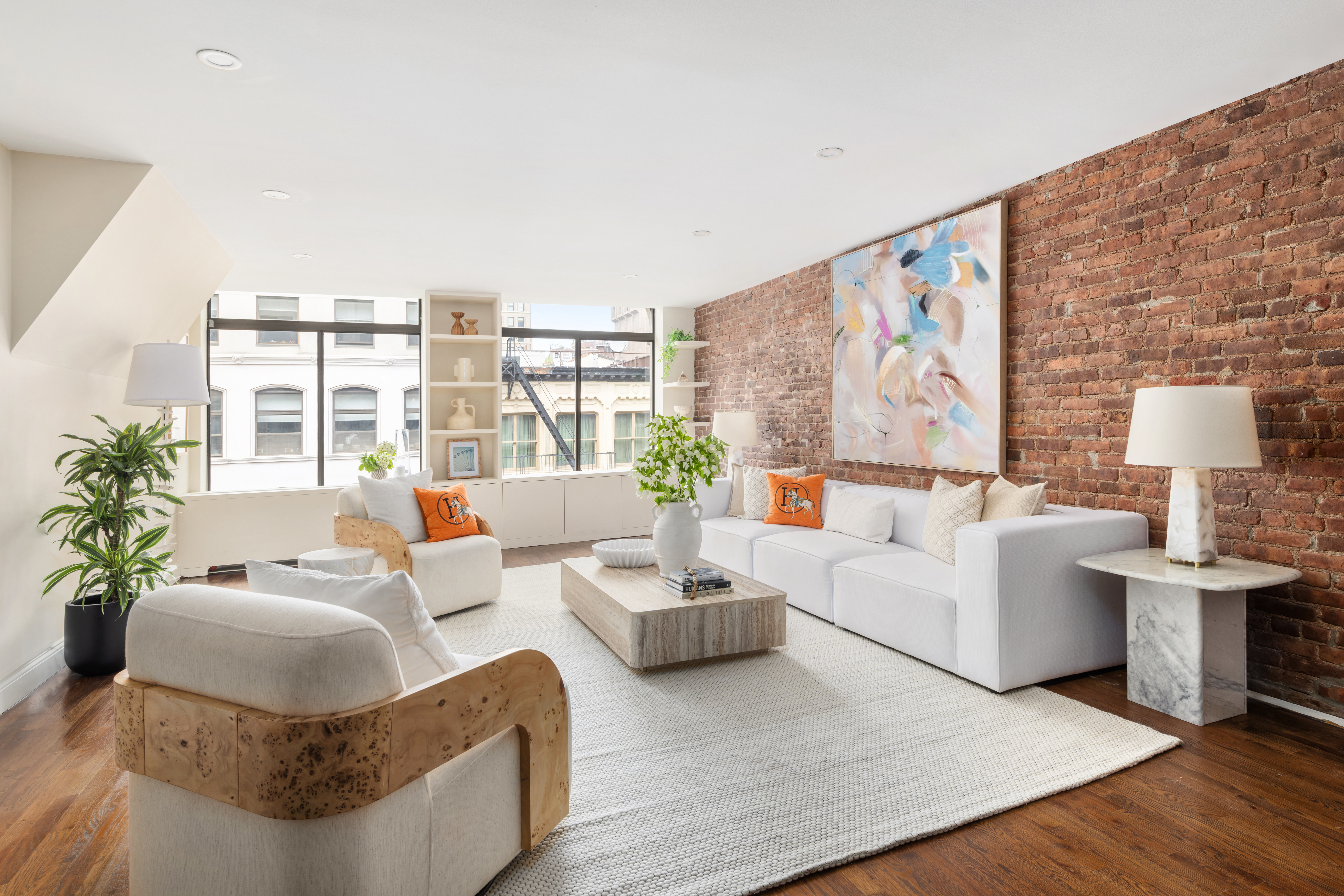 99 Reade Street, Unit 5E Manhattan, NY 10013 - Photo 1 of 13 a living room with furniture and painting on the wall