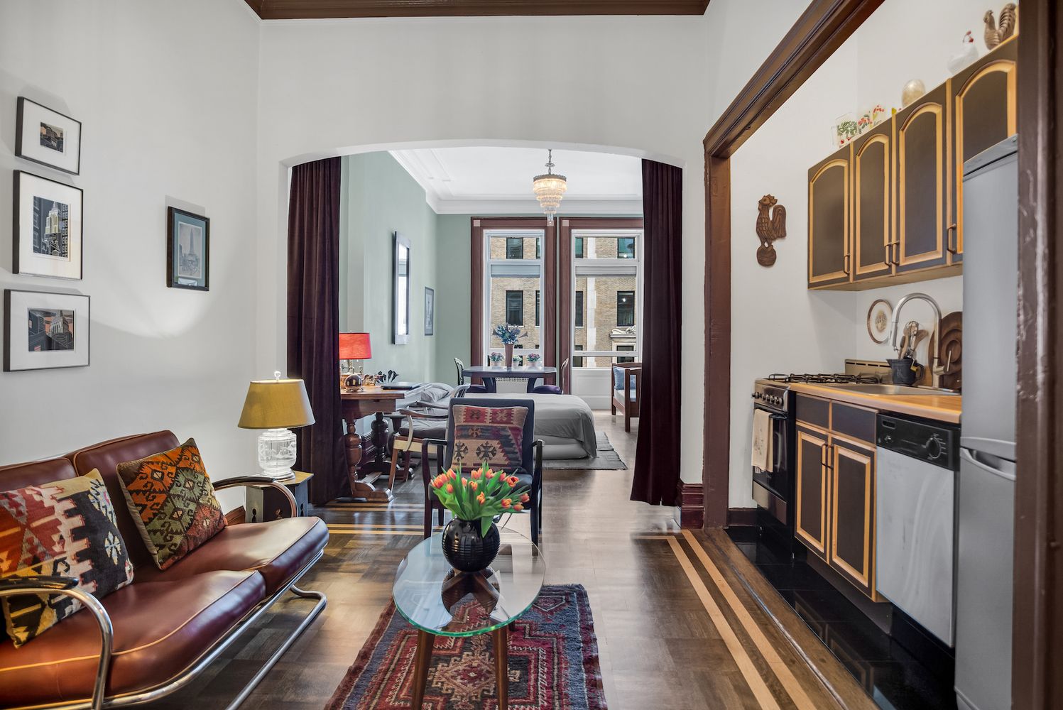 284 5th Avenue, Unit 5F Manhattan, NY 10001 - Photo 5 of 19 a living room with furniture fireplace and flat screen tv