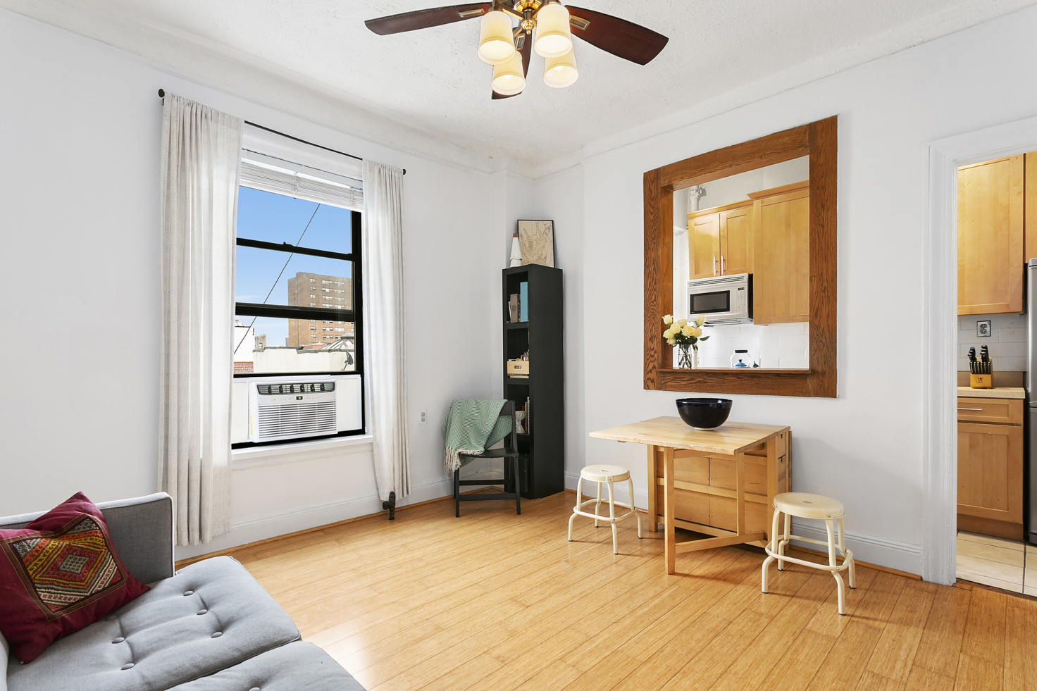 544 West 157th Street, Unit 85 Manhattan, NY 10032 - Photo 5 of 6 a living room with furniture and a window
