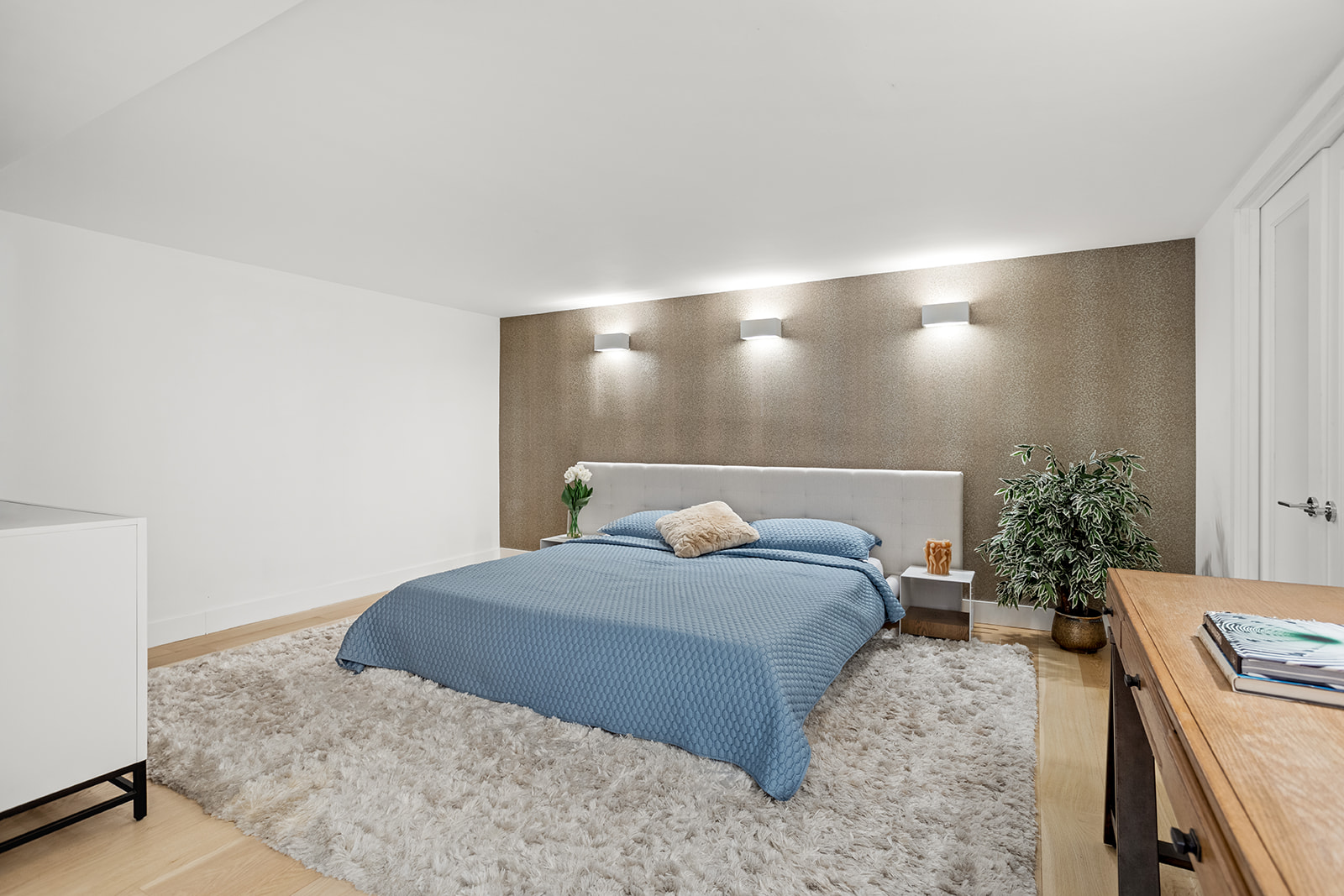 125 East 12th Street, Unit 1E Manhattan, NY 10003 - Photo 9 of 16 a bedroom with a bed and a potted plant