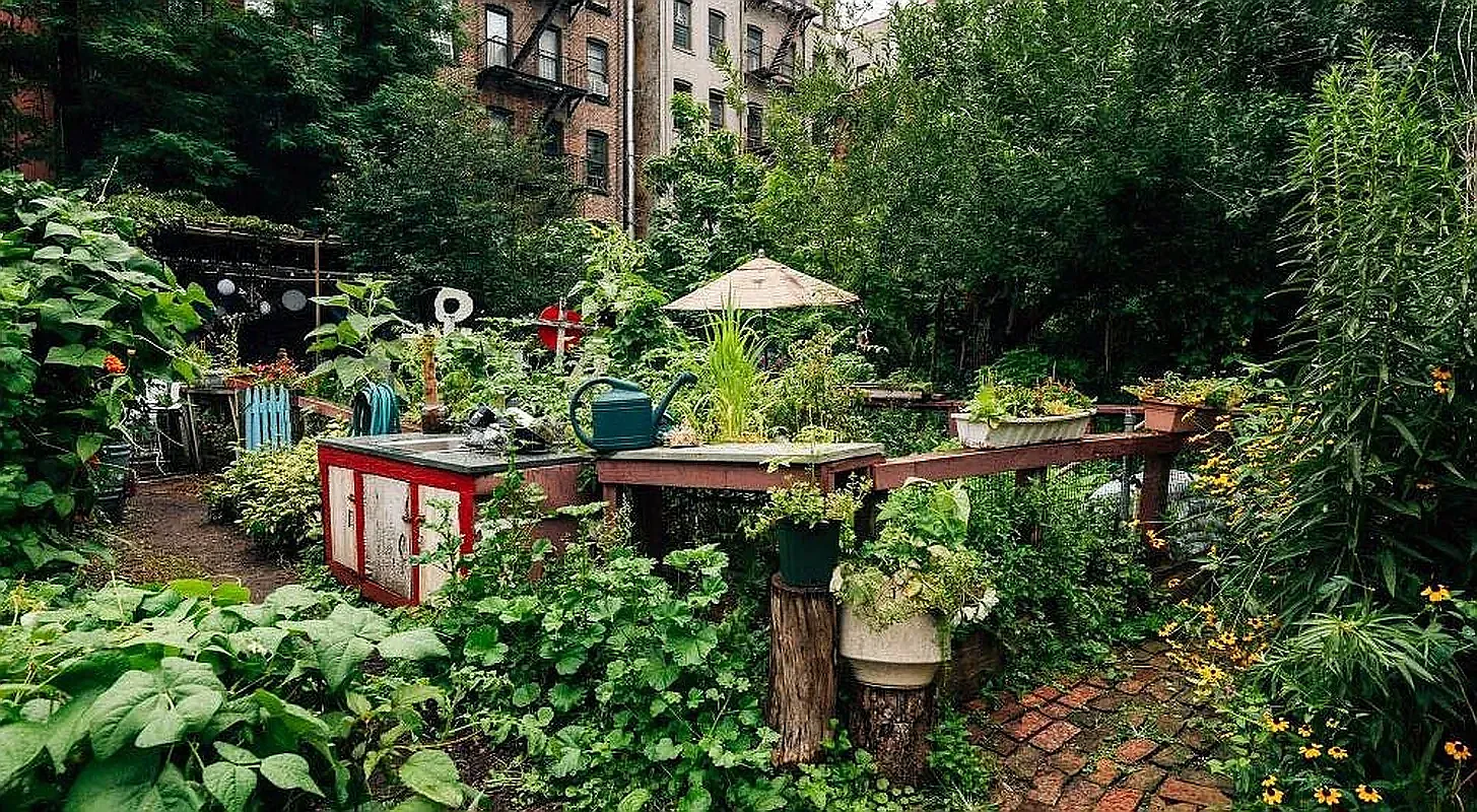 107 East 2nd Street, Unit 11 Manhattan, NY 10009 - Photo 6 of 7 a backyard of a house with a yard and outdoor seating