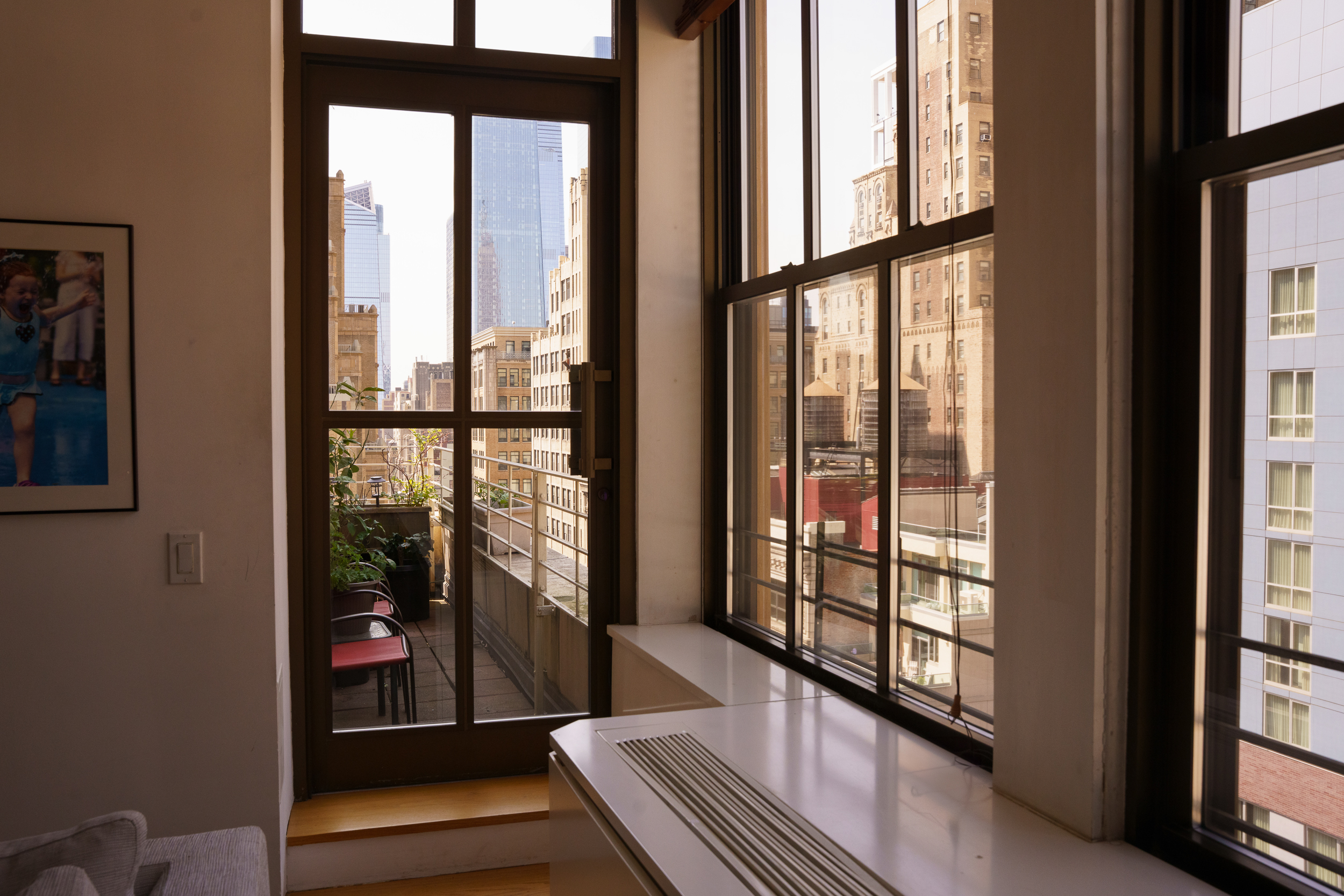130 West 30th Street, Unit 16A Manhattan, NY 10001 - Photo 16 of 17 a view of a glass door with a balcony