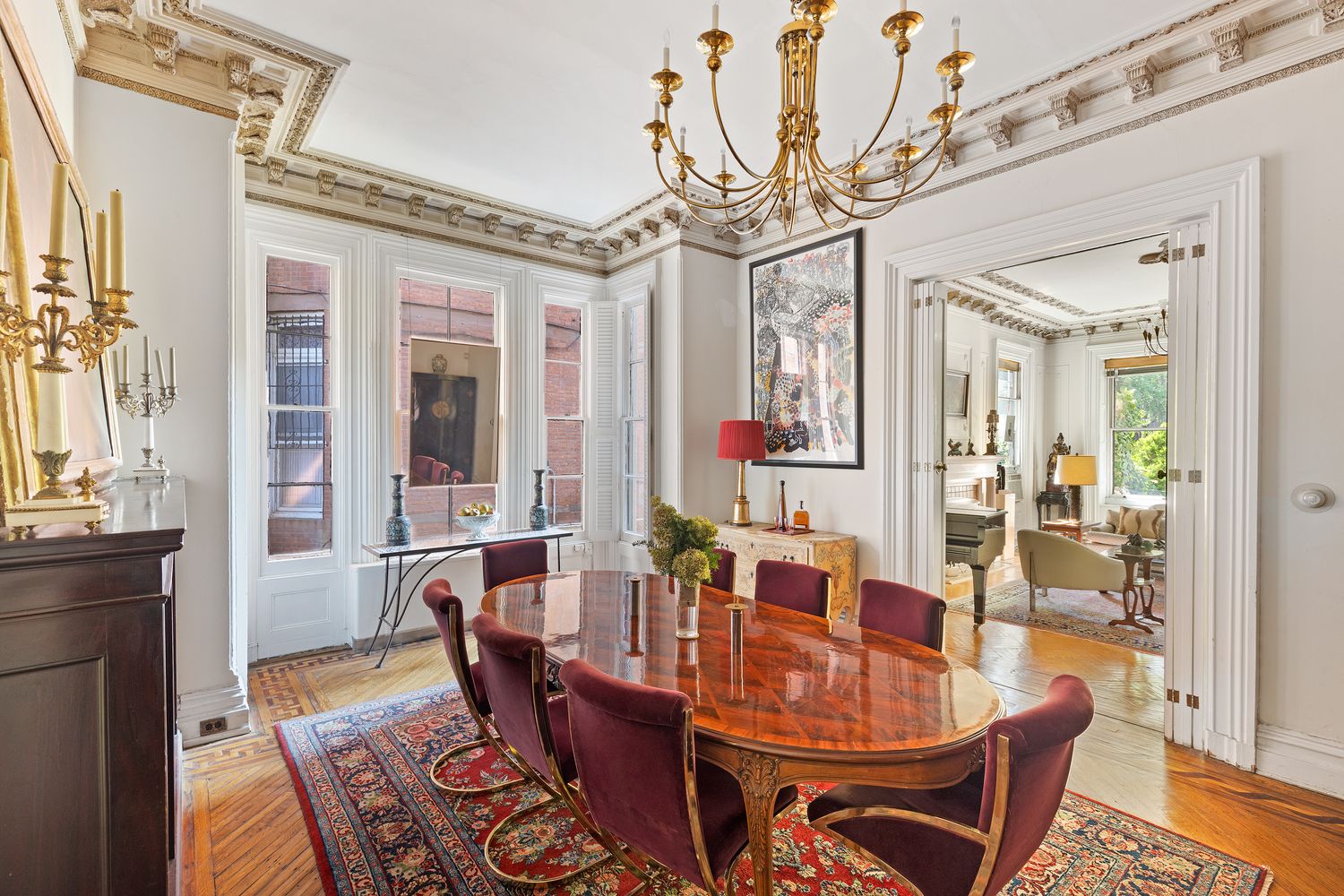 315 Washington Avenue Brooklyn, NY 11205 - Photo 8 of 38 a dining room with furniture a chandelier and wooden floor