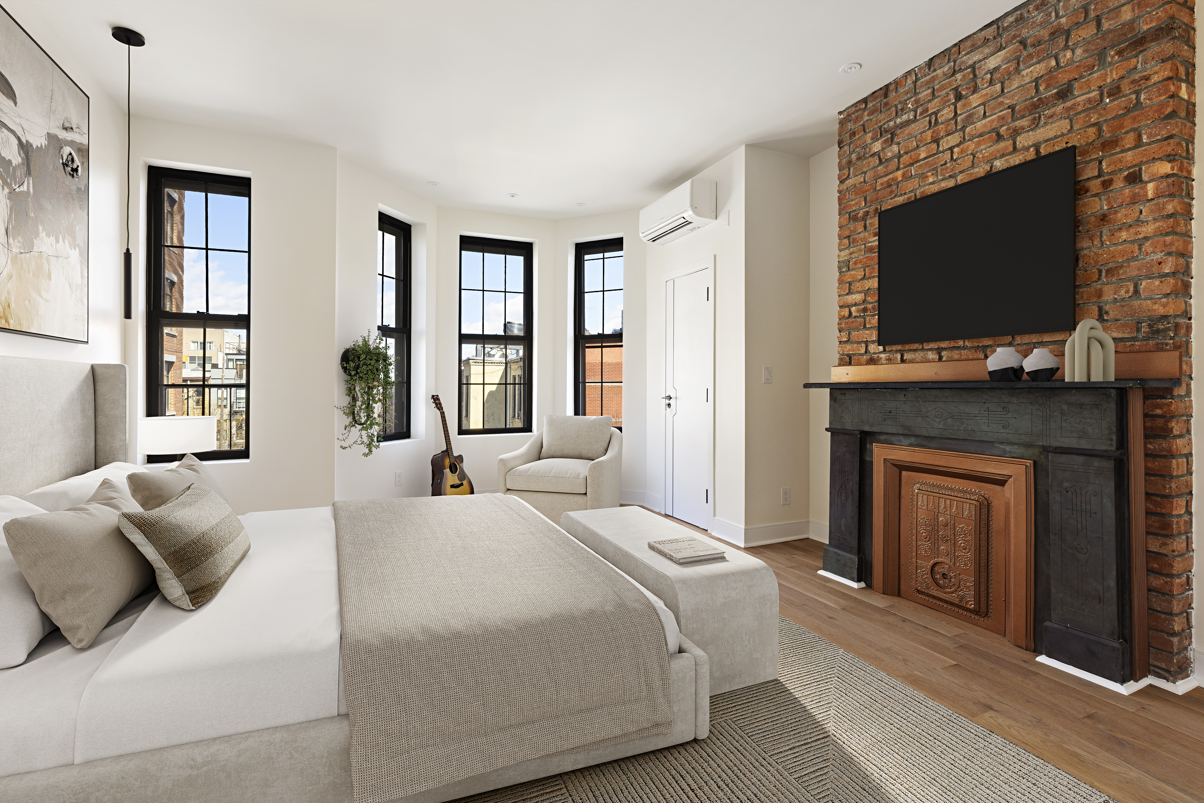 a bedroom with a bed and a flat screen tv