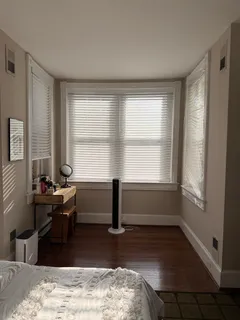 a room with furniture window and wooden floor