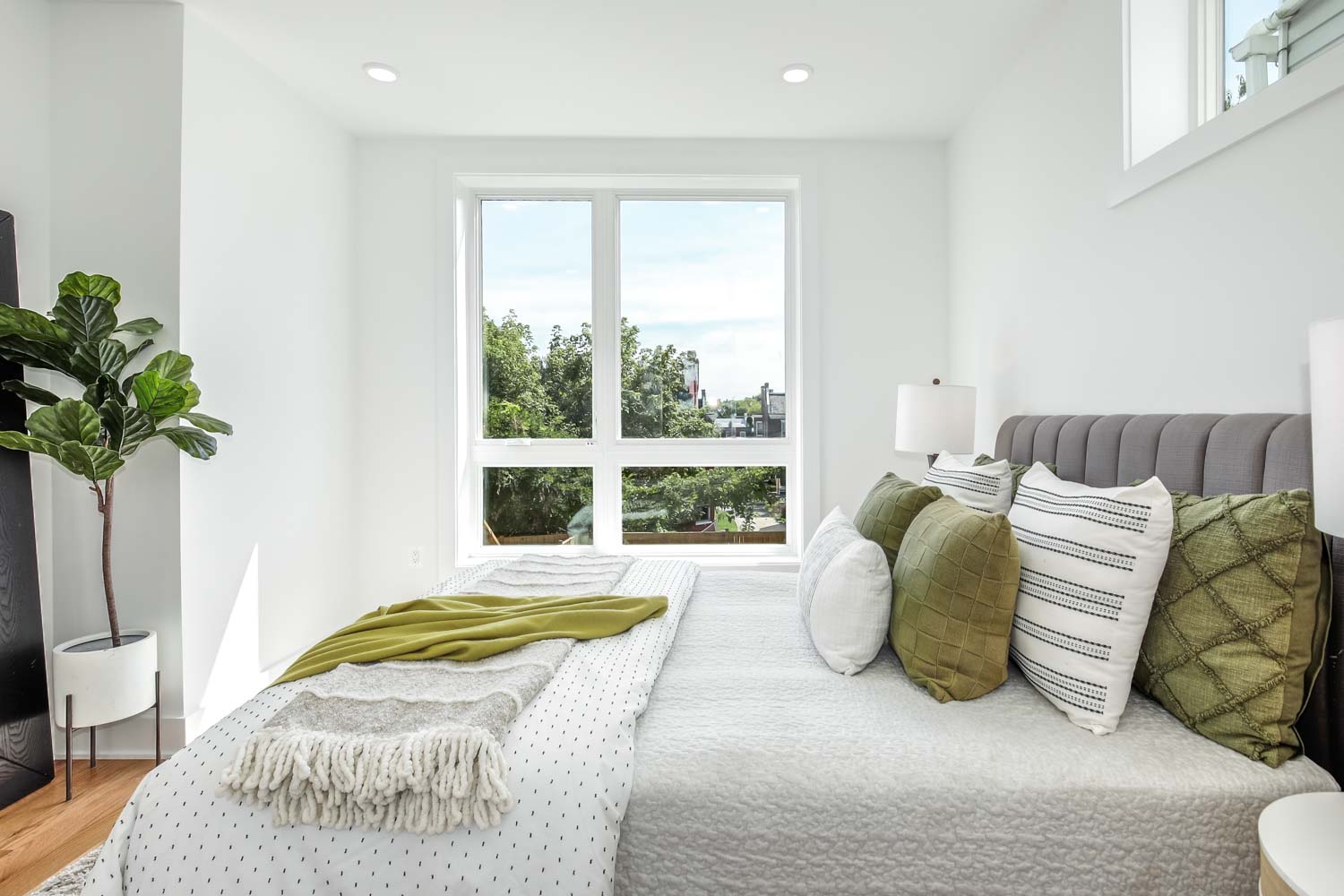 428 Manor Place Northwest, Unit 1 Washington, DC 20010 - Photo 19 of 27 a bed sitting in a bedroom next to a window