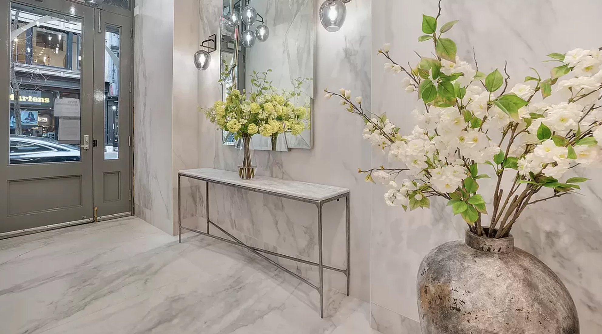 145 Spring Street, Unit PH Manhattan, NY 10012 - Photo 10 of 11 a vase of flowers sitting on a table