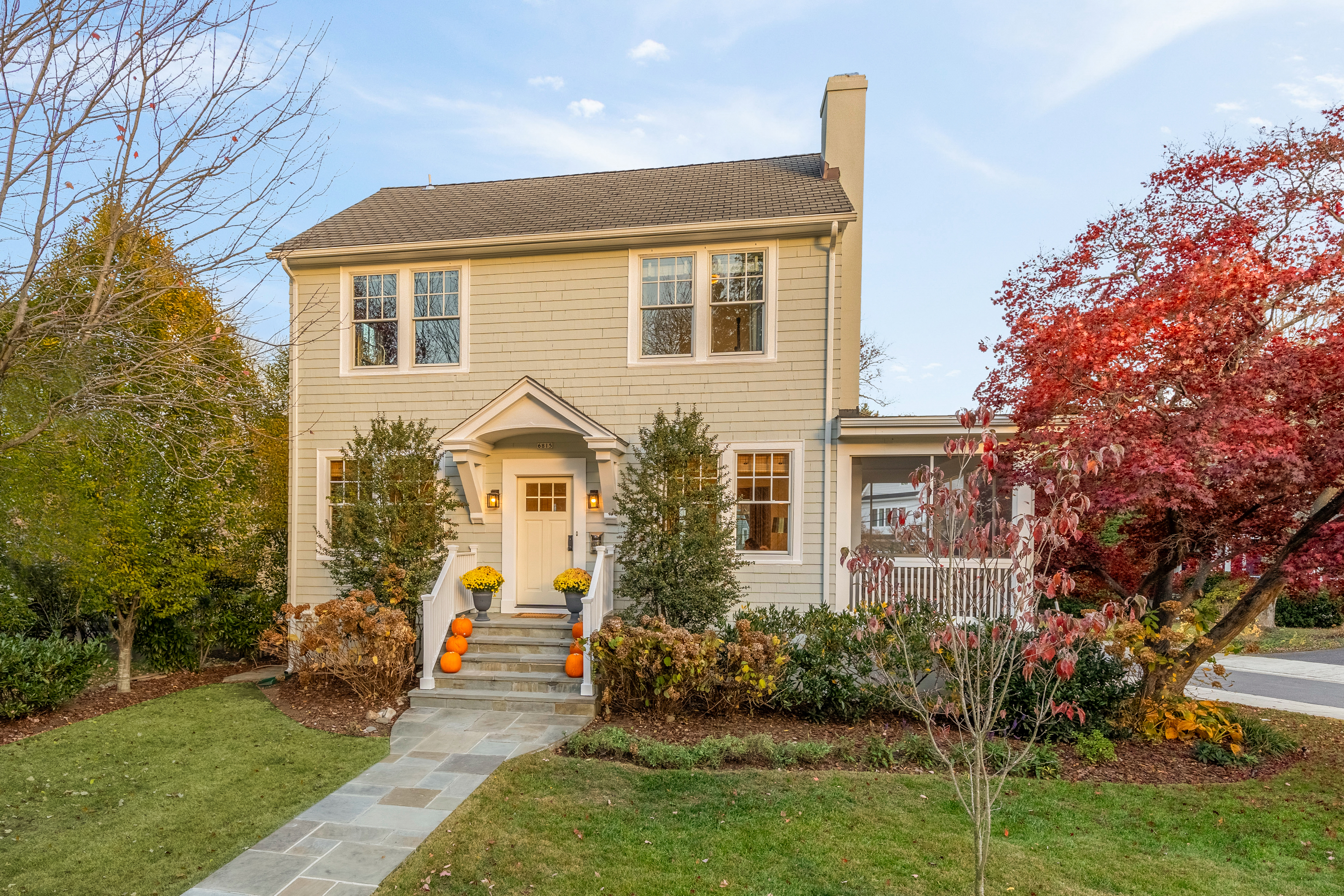 6815 Delaware Street Chevy Chase, MD 20815 - Photo 1 of 34 a front view of a house with a yard