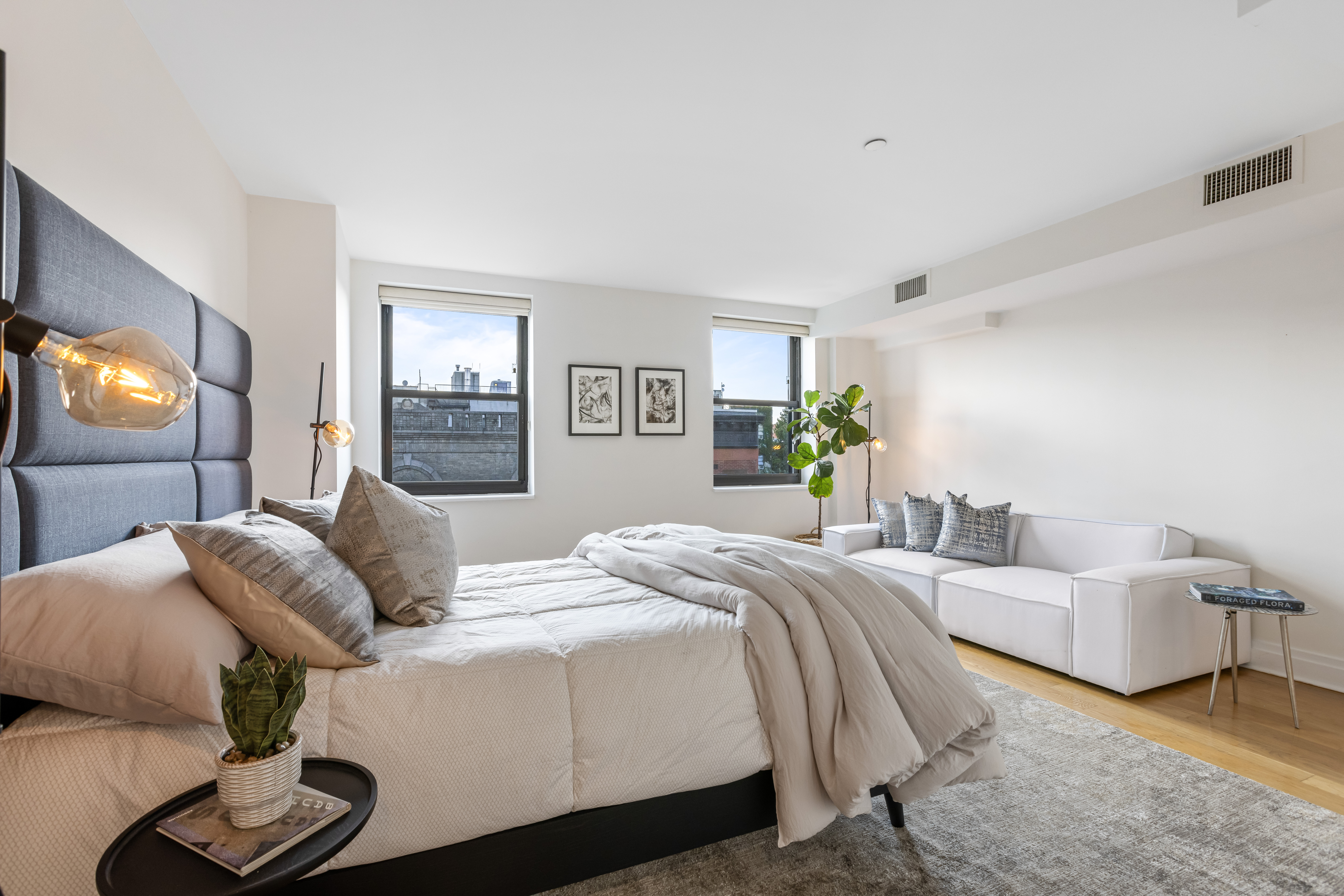 257 West 117th Street, Unit 6A Manhattan, NY 10026 - Photo 7 of 16 a bedroom with bed and a flat screen tv