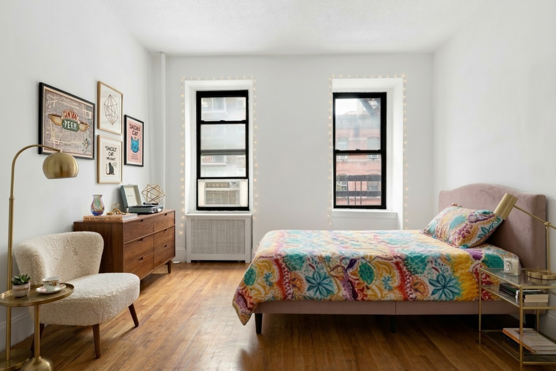 215 East 88th Street, Unit 4A Manhattan, NY 10128 - Photo 5 of 11 a bedroom with a bed and wooden floor