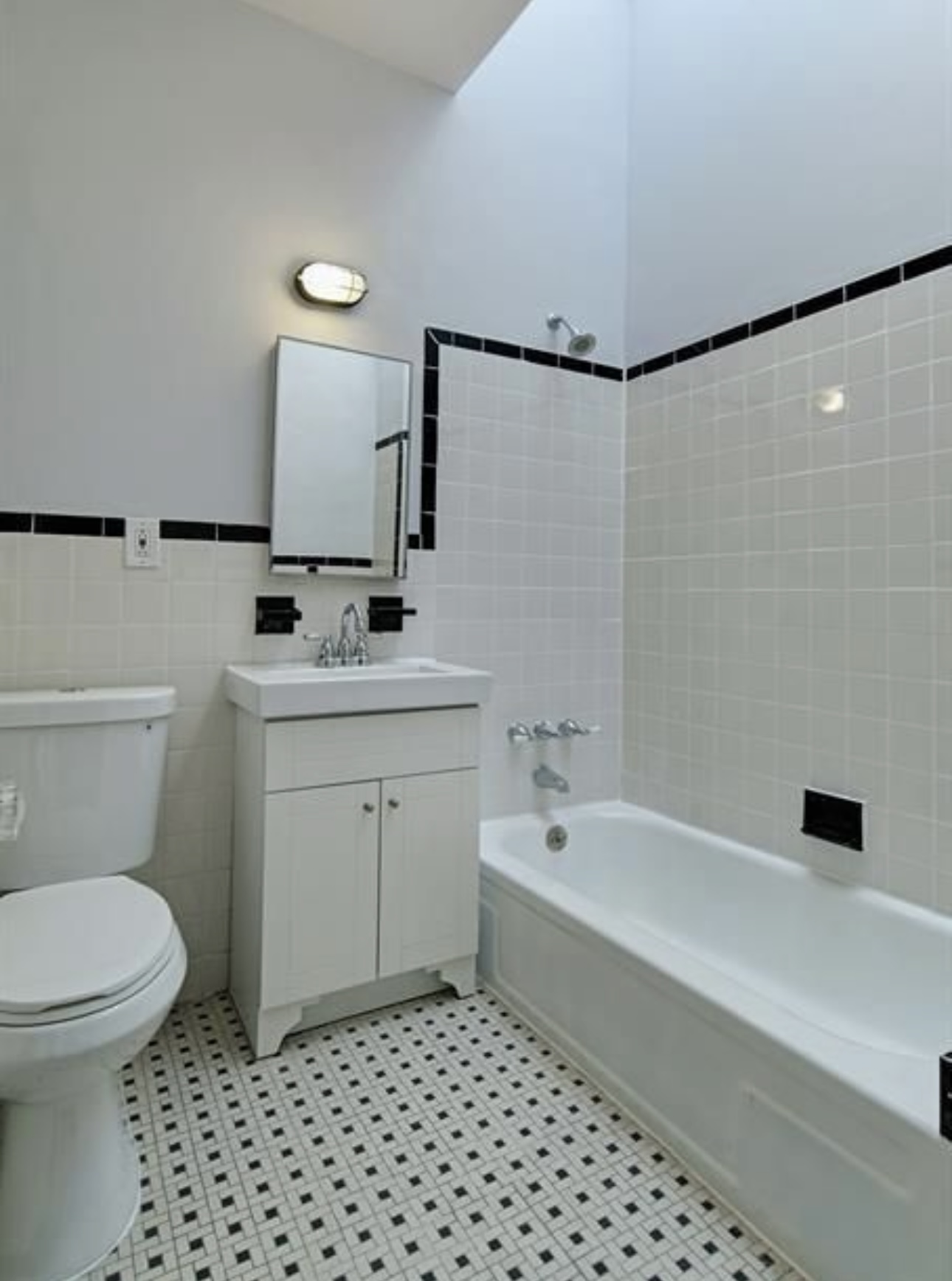 195 Adelphi Street, Unit 3 Brooklyn, NY 11205 - Photo 5 of 7 a bathroom with a sink a toilet and shower