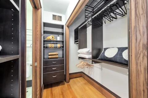 a bathroom with a granite countertop sink and shower