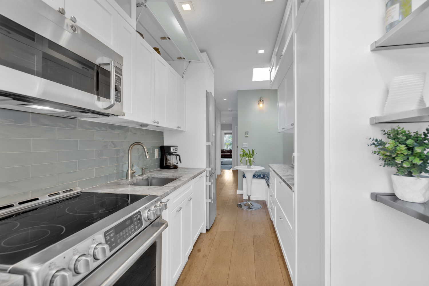39 Clifton Place Brooklyn, NY 11238 - Photo 10 of 32 a kitchen with stainless steel appliances kitchen island a stove a sink and a refrigerator
