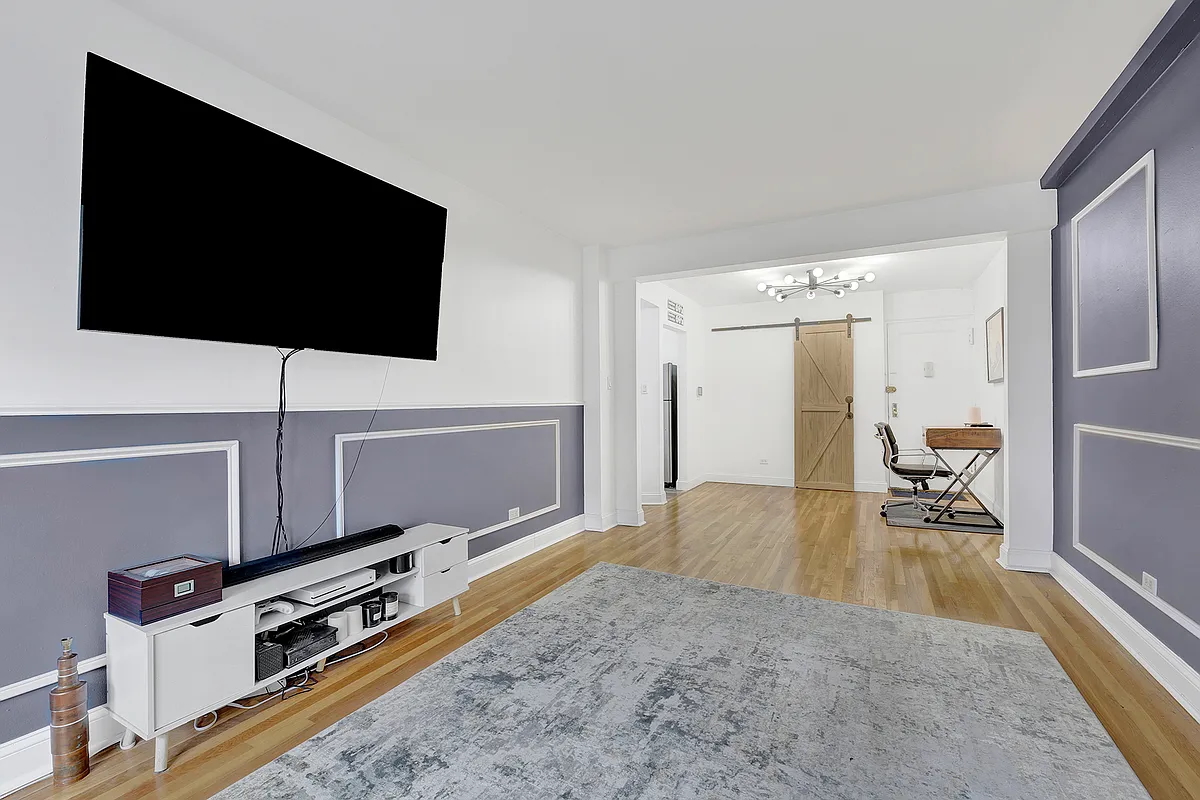 9040 Fort Hamilton Parkway, Unit 4G Brooklyn, NY 11209 - Photo 3 of 12 a living room with furniture and a flat screen tv