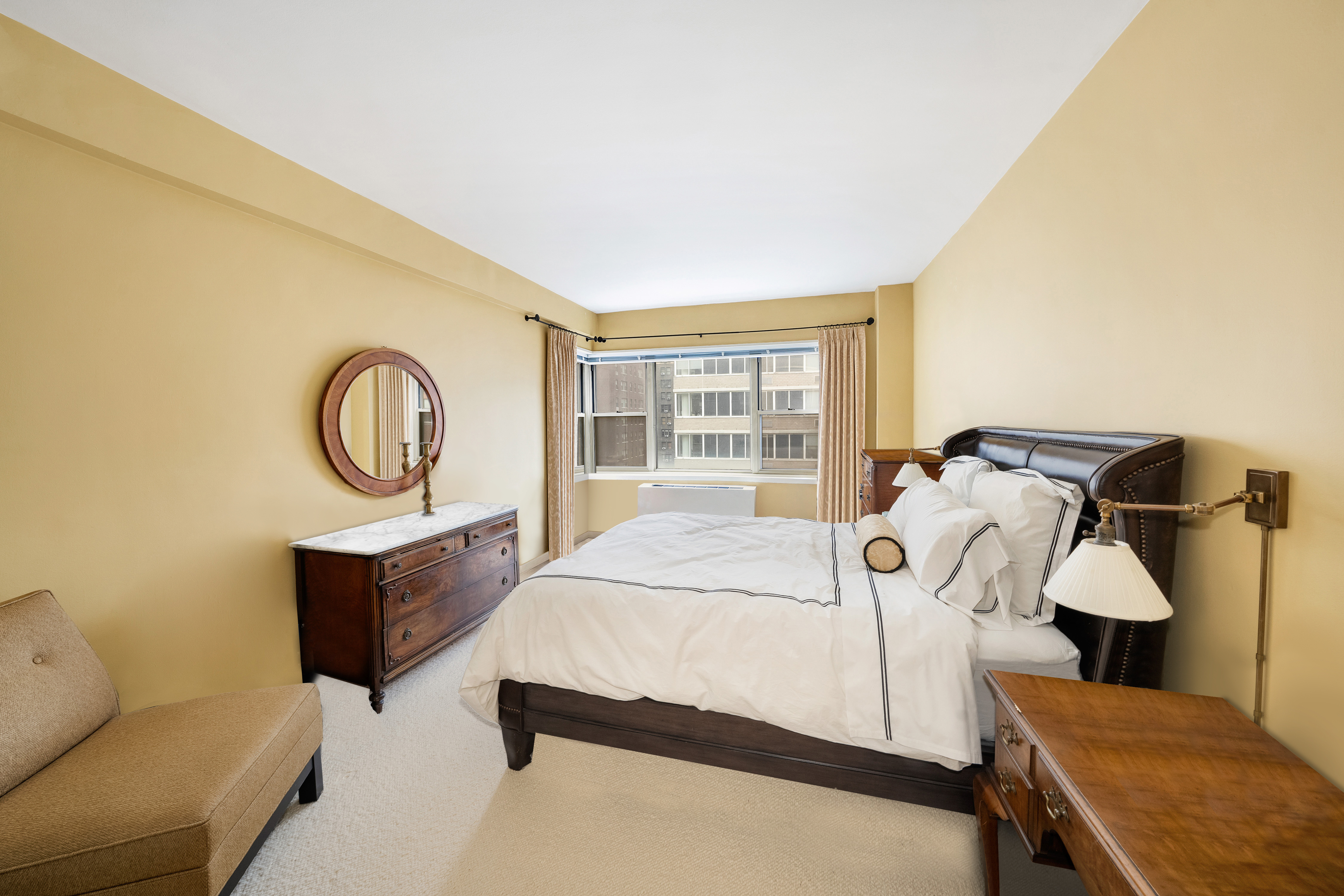 415 East 52nd Street, Unit 9BC Manhattan, NY 10022 - Photo 4 of 7 a bed room with a bed and a window