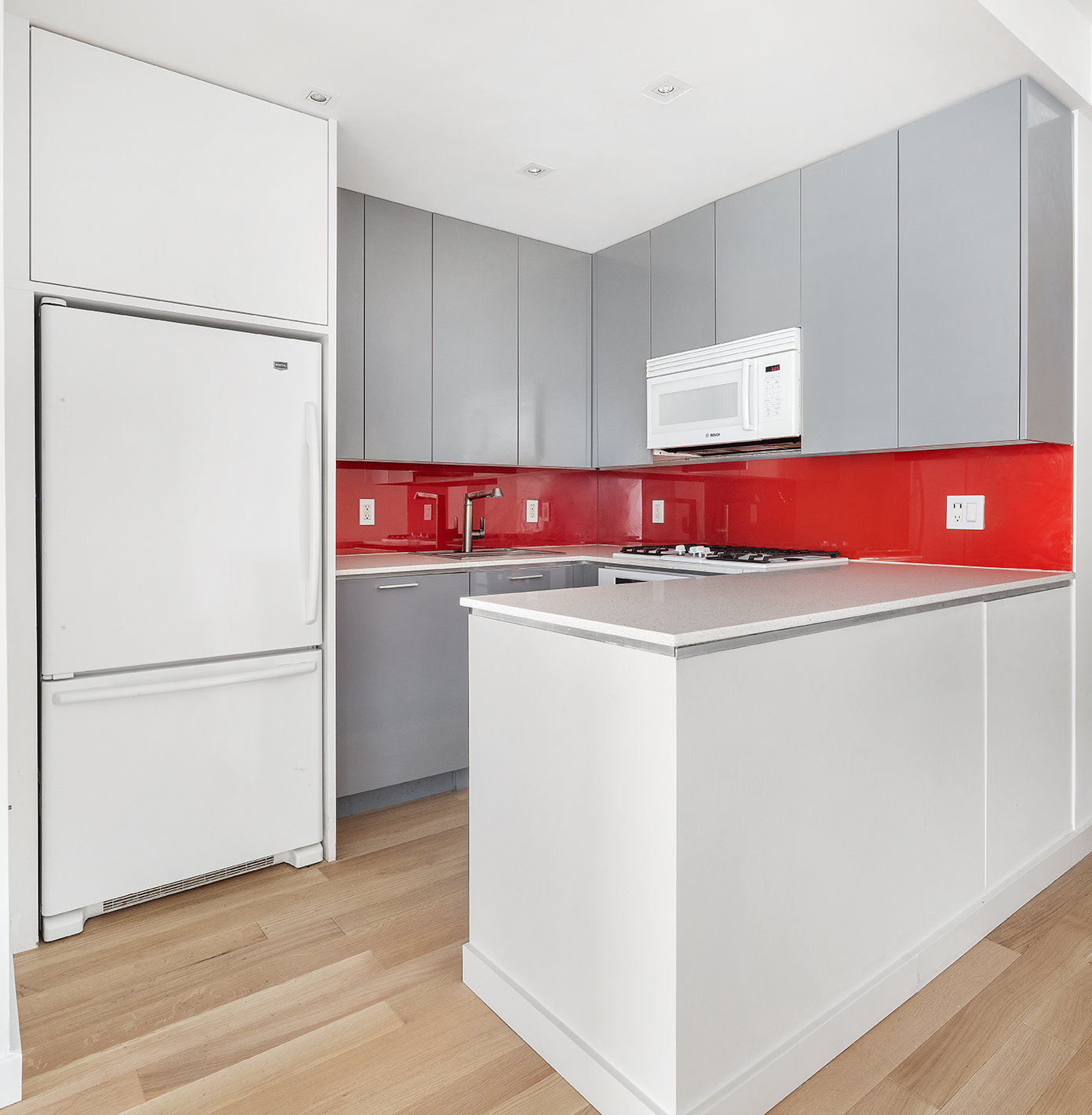 145 Park Place, Unit 3F Brooklyn, NY 11217 - Photo 3 of 9 a kitchen with refrigerator a stove and a refrigerator