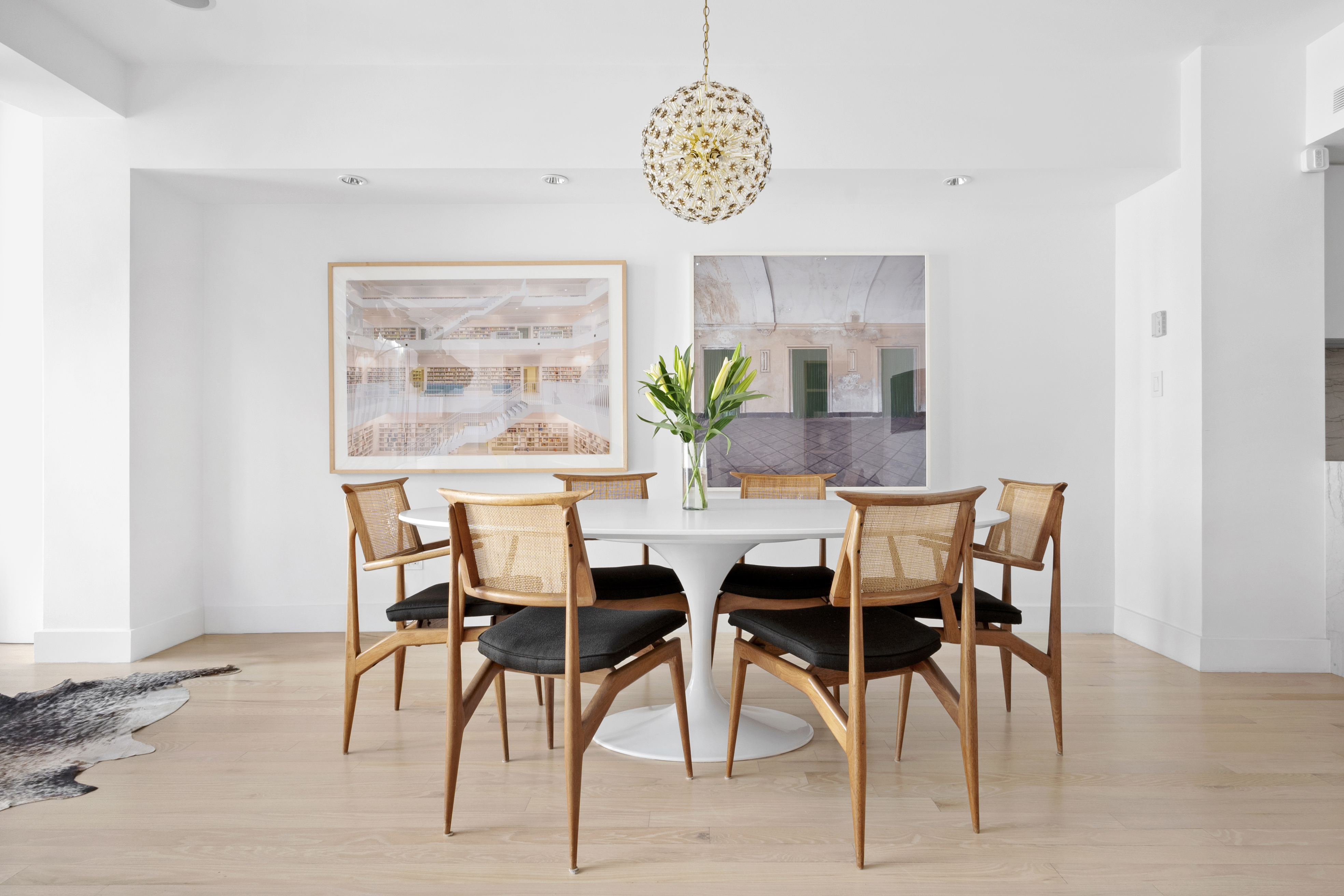 116 West 22nd Street, Unit 5 Manhattan, NY 10011 - Photo 4 of 15 a view of a dining room with furniture and a potted plant