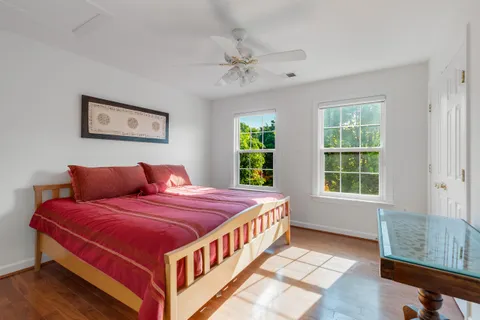 a bed room with a bed and a window