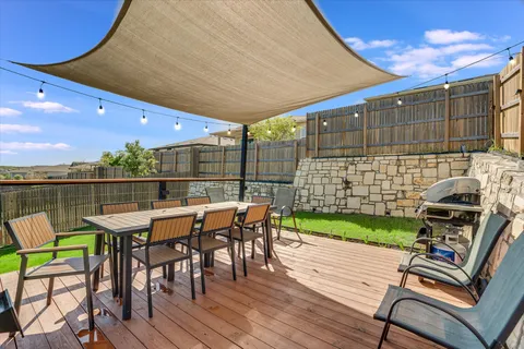 a patio with table and chairs