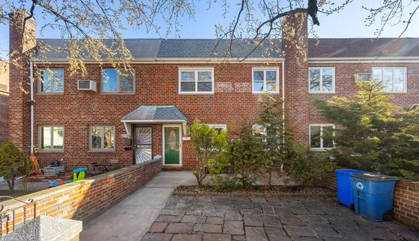 a front view of a house with yard