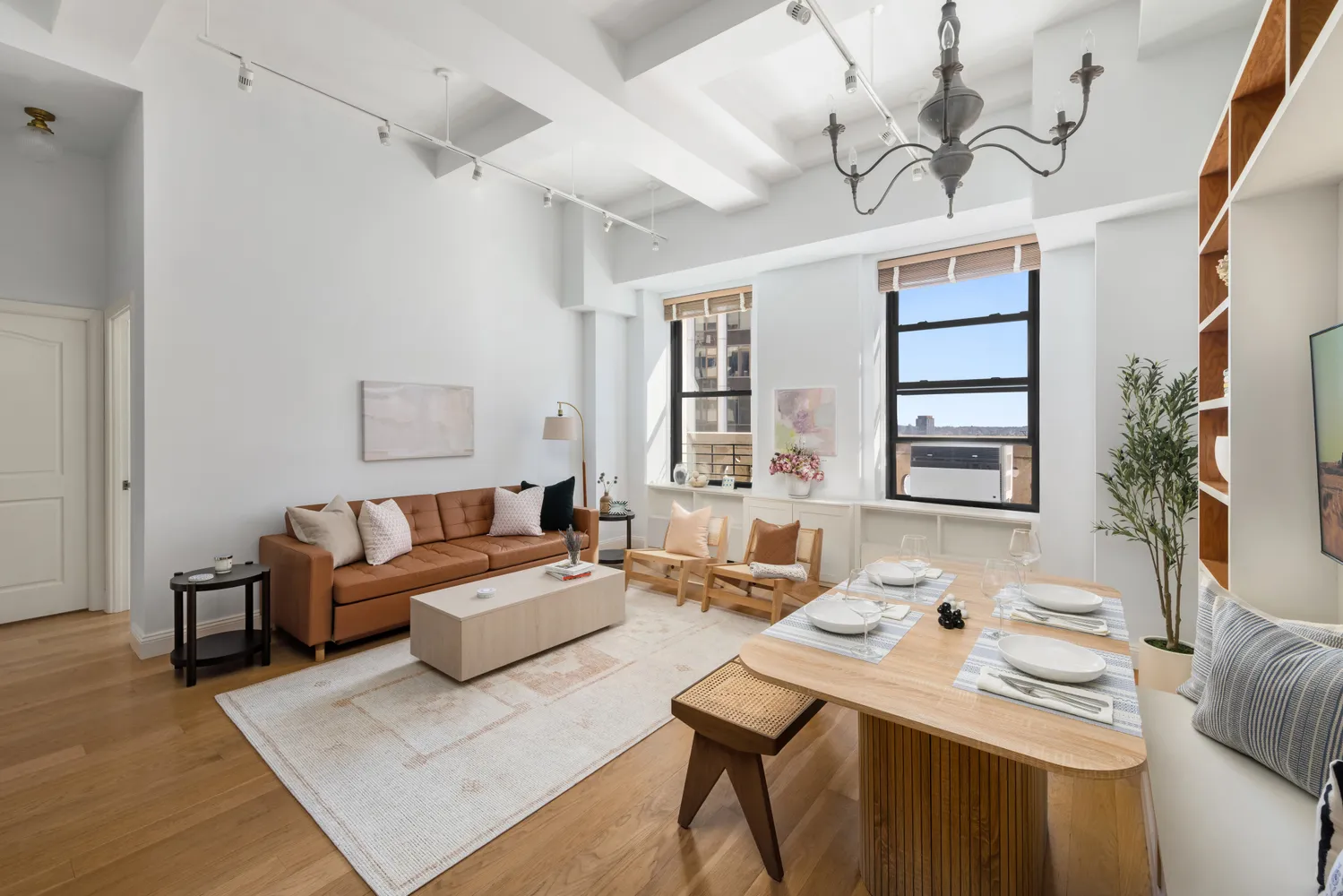 a living room with furniture and wooden floor