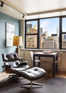 a bedroom with furniture and a window