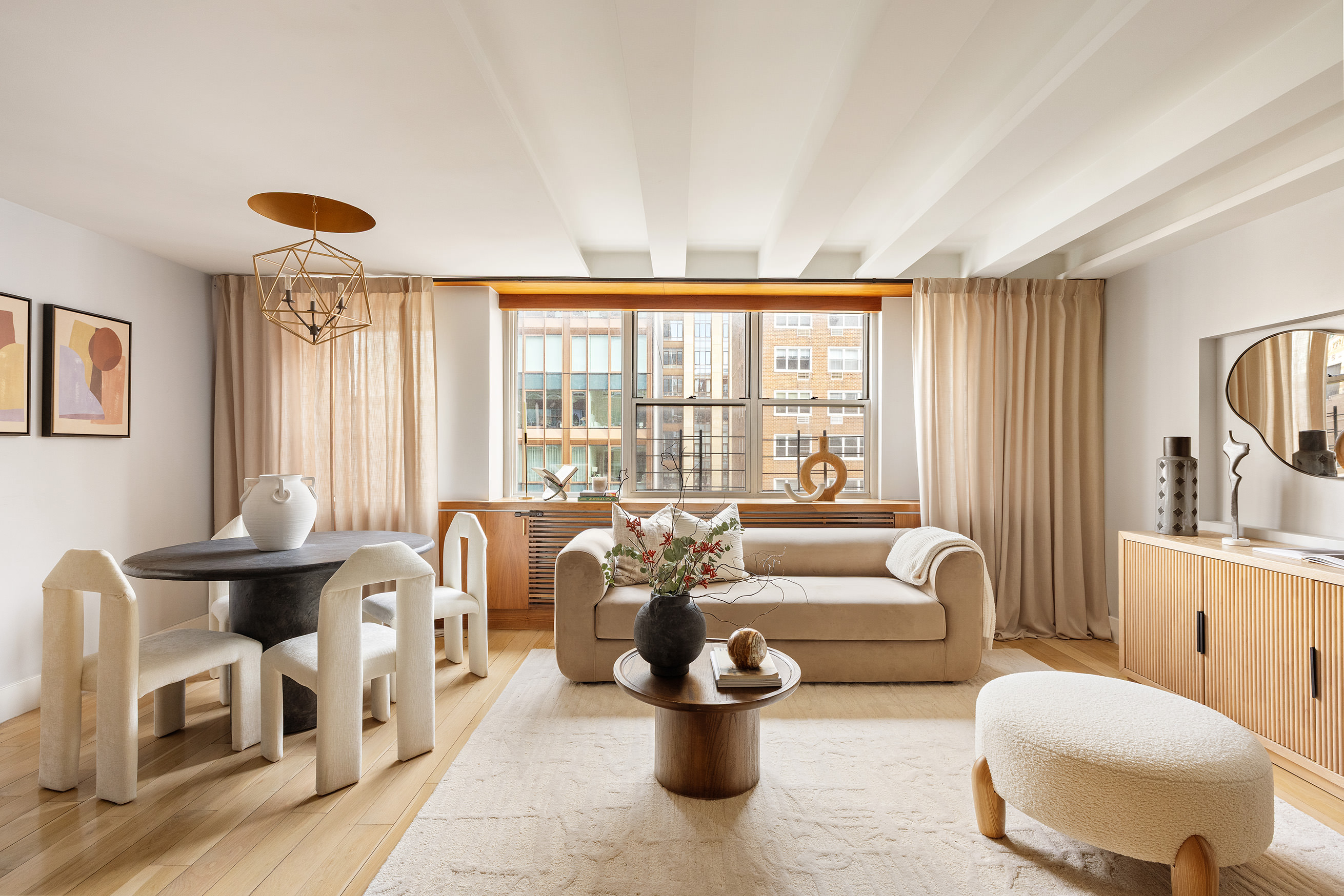 32 Gramercy Park South, Unit 12D Manhattan, NY 10003 - Photo 2 of 14 a living room with furniture and a large window