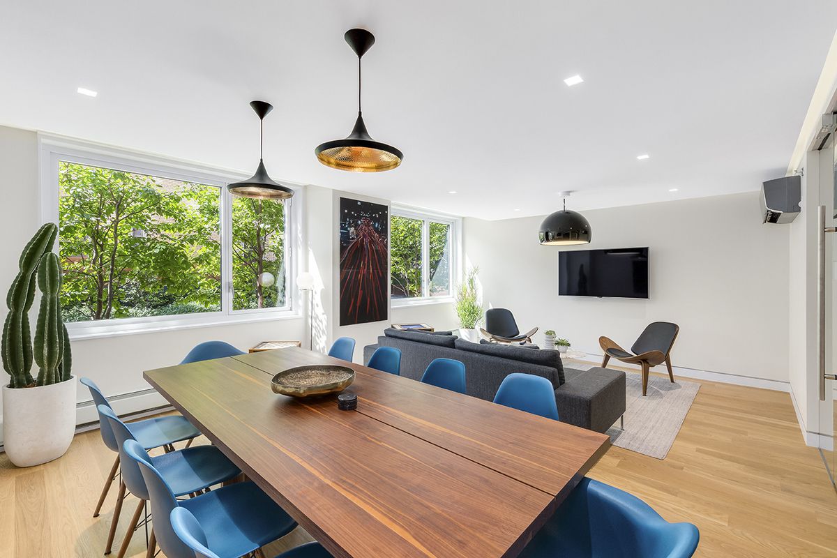 301 West 53rd Street, Unit 13C Manhattan, NY 10019 - Photo 10 of 13 a view of a dining room with furniture window and outside view