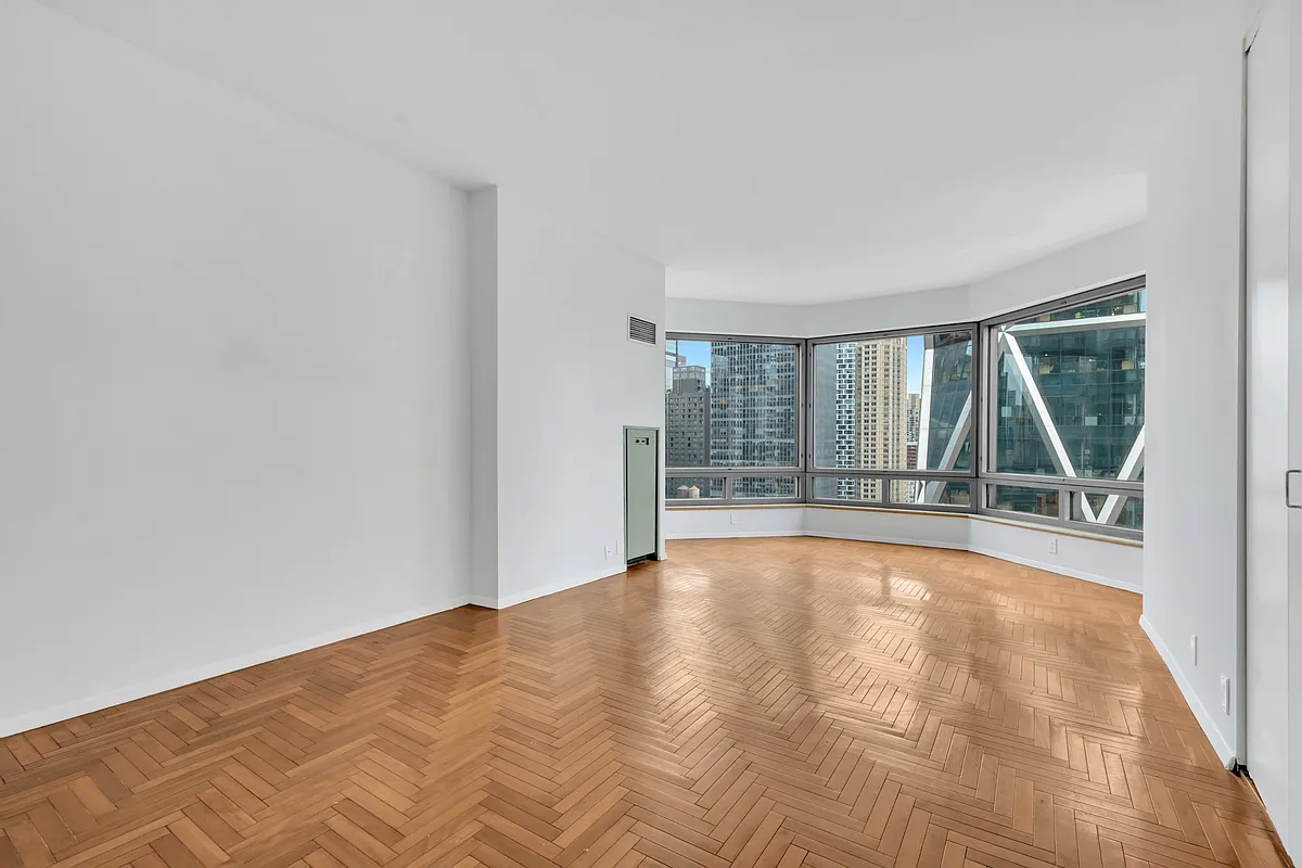 301 West 57th Street, Unit 22E Manhattan, NY 10019 - Photo 6 of 13 a view of an empty room with a window
