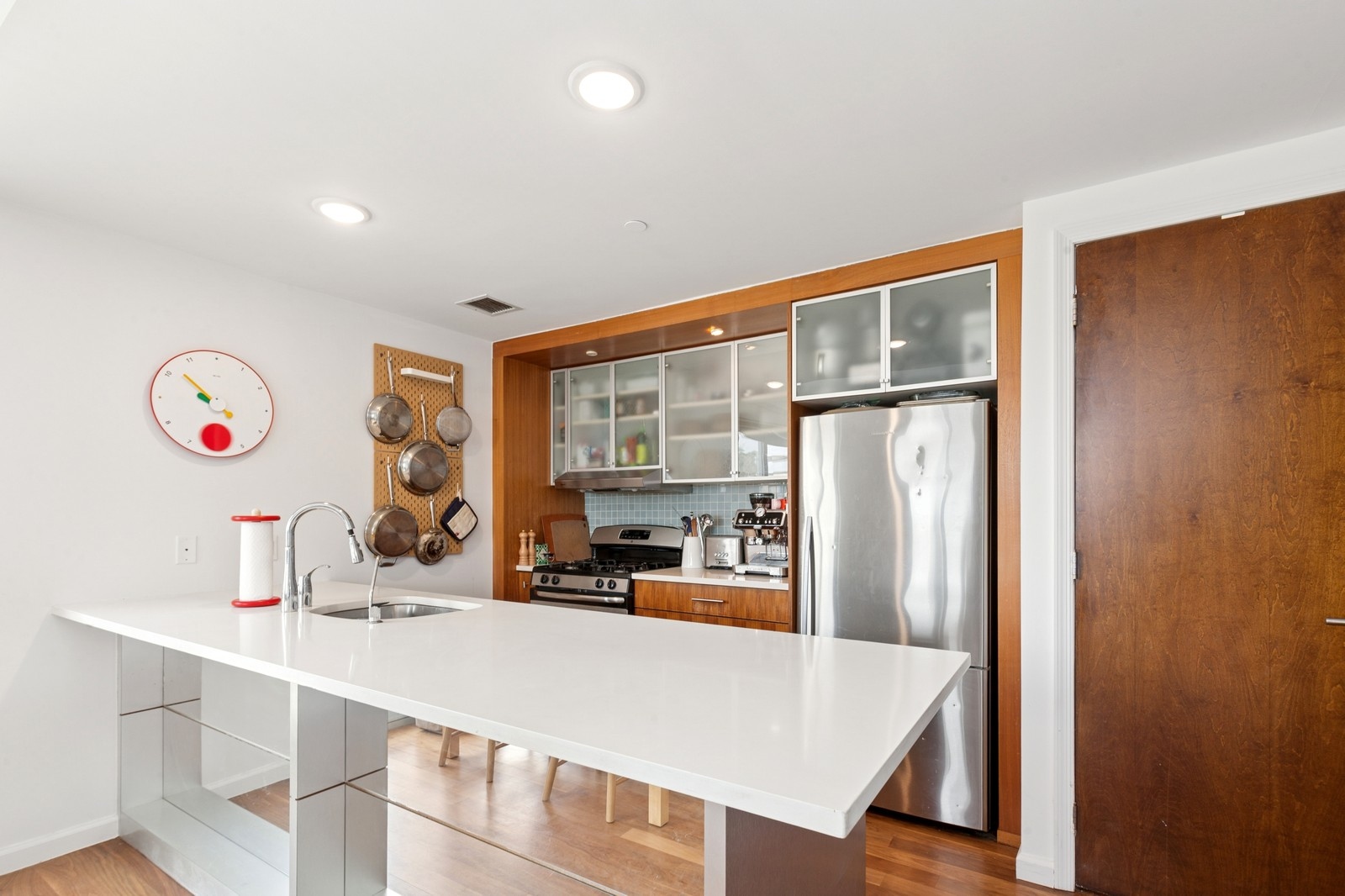 154 Skillman Avenue, Unit 5A Brooklyn, NY 11211 - Photo 4 of 11 a kitchen with stainless steel appliances a refrigerator and sink