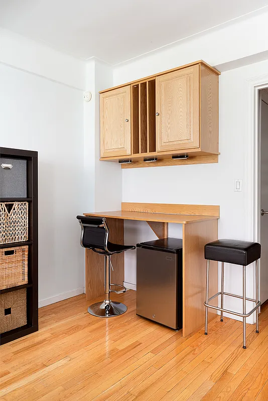 433 West 34th Street, Unit 3E Manhattan, NY 10001 - Photo 3 of 10 a work place with furniture and wooden floor