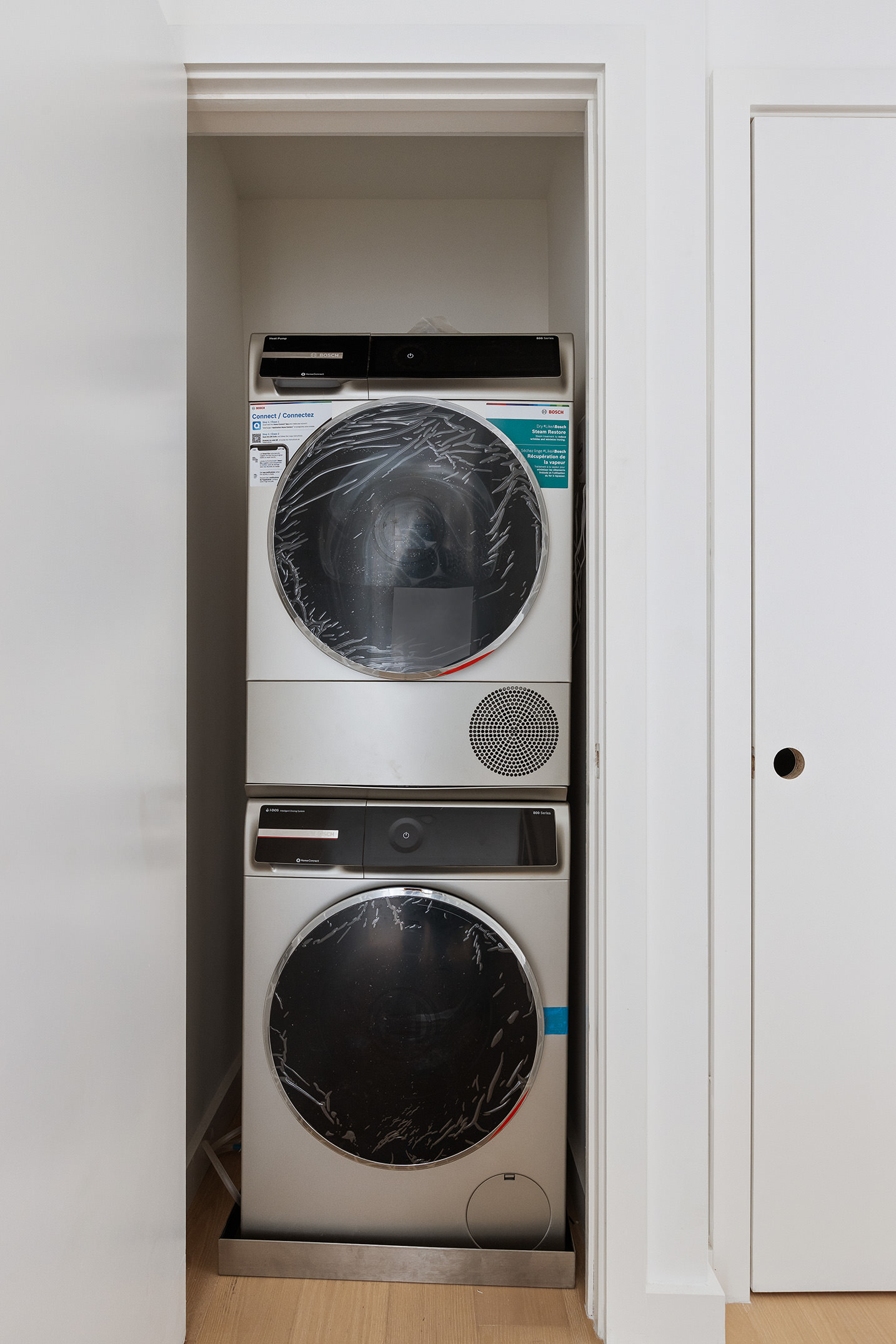 175 West 12th Street, Unit 20E Manhattan, NY 10011 - Photo 7 of 12 a utility room with dryer and washer