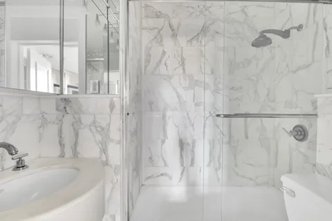 a bathroom with a bathtub and shower