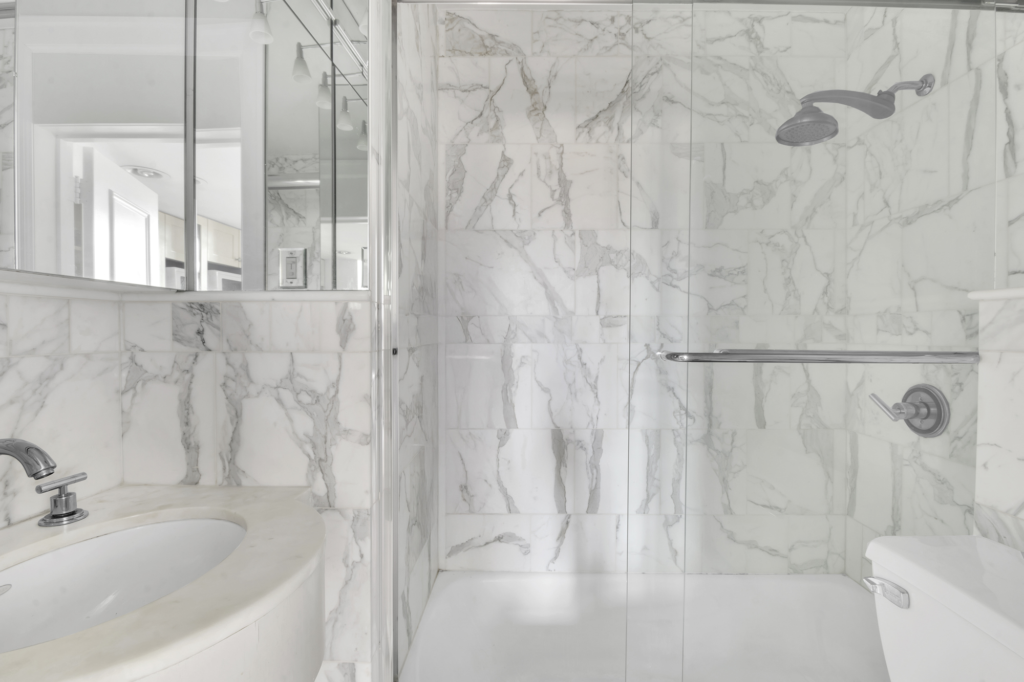 140 West 69th Street, Unit 107A Manhattan, NY 10023 - Photo 13 of 15 a bathroom with a bathtub and shower