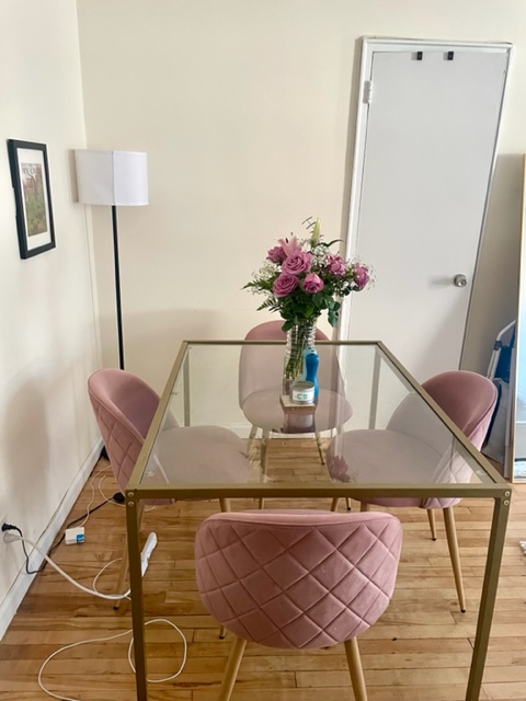 210 East 60th Street, Unit 4 Manhattan, NY 10022 - Photo 2 of 8 a view of a dining room with furniture and wooden floor