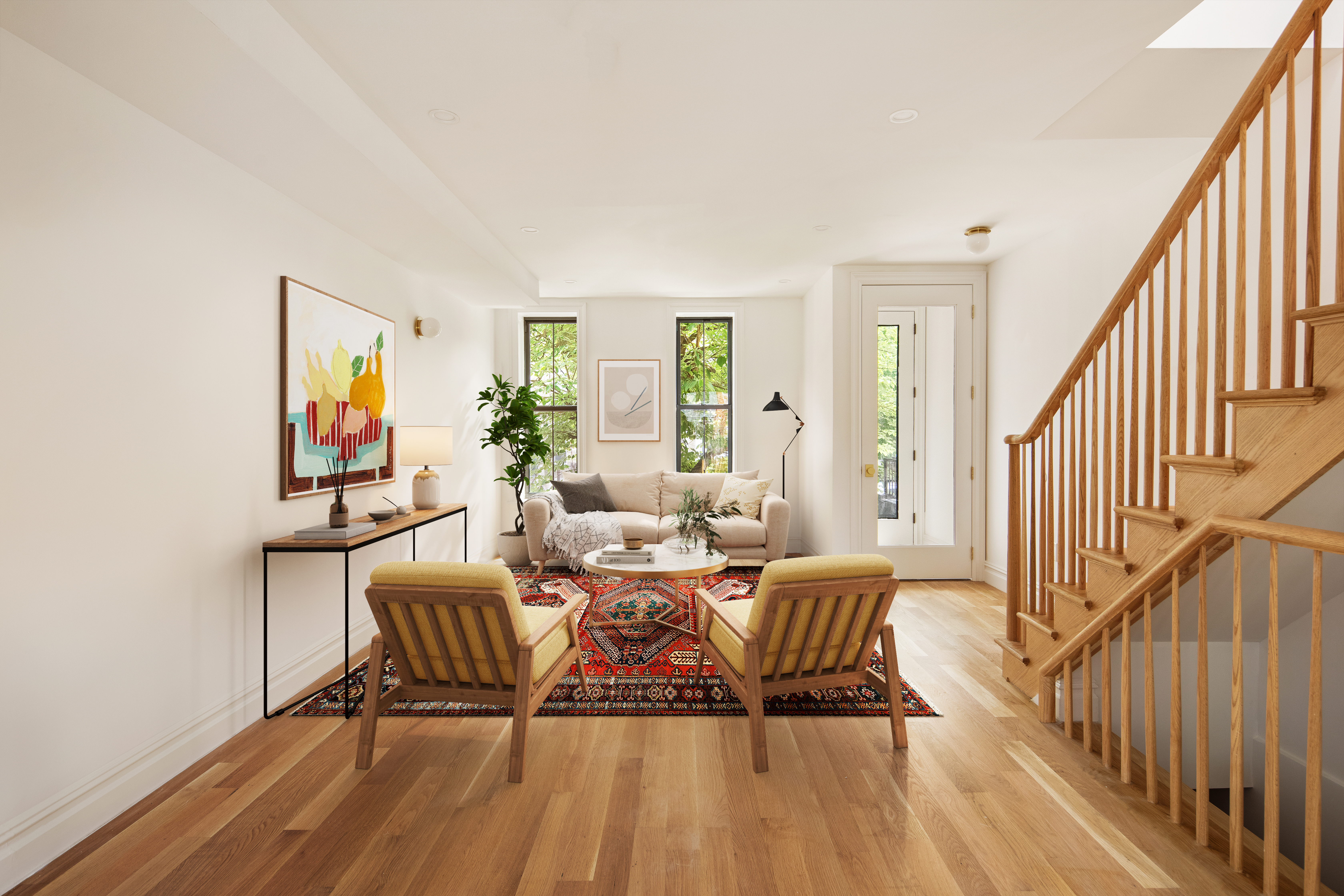 a living room with furniture and wooden floor