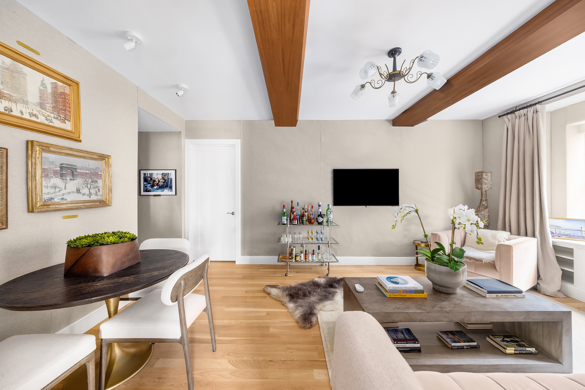 110 Central Park South, Unit 12ABC Manhattan, NY 10019 - Photo 25 of 49 a living room with furniture and a flat screen tv