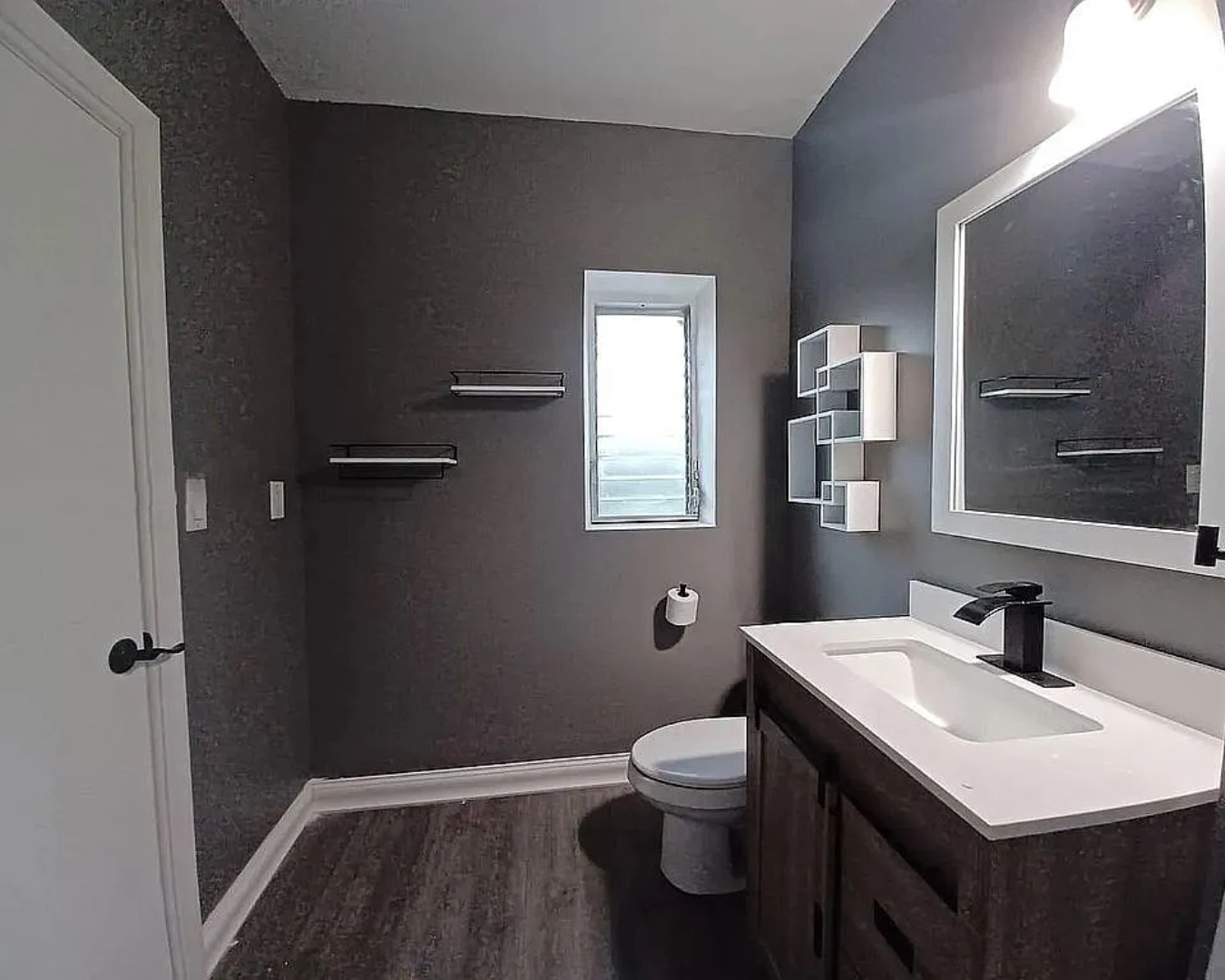 2822 Pine Tree Drive Miami Beach, FL 33140 - Photo 19 of 21 a bathroom with a sink toilet and vanity