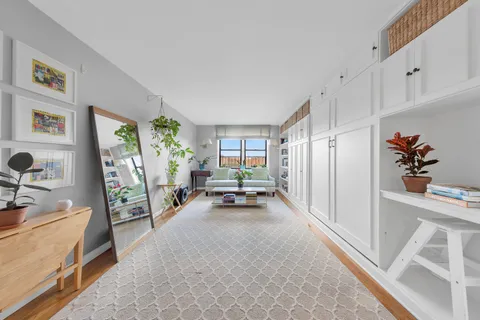 a view of a livingroom with furniture and toys
