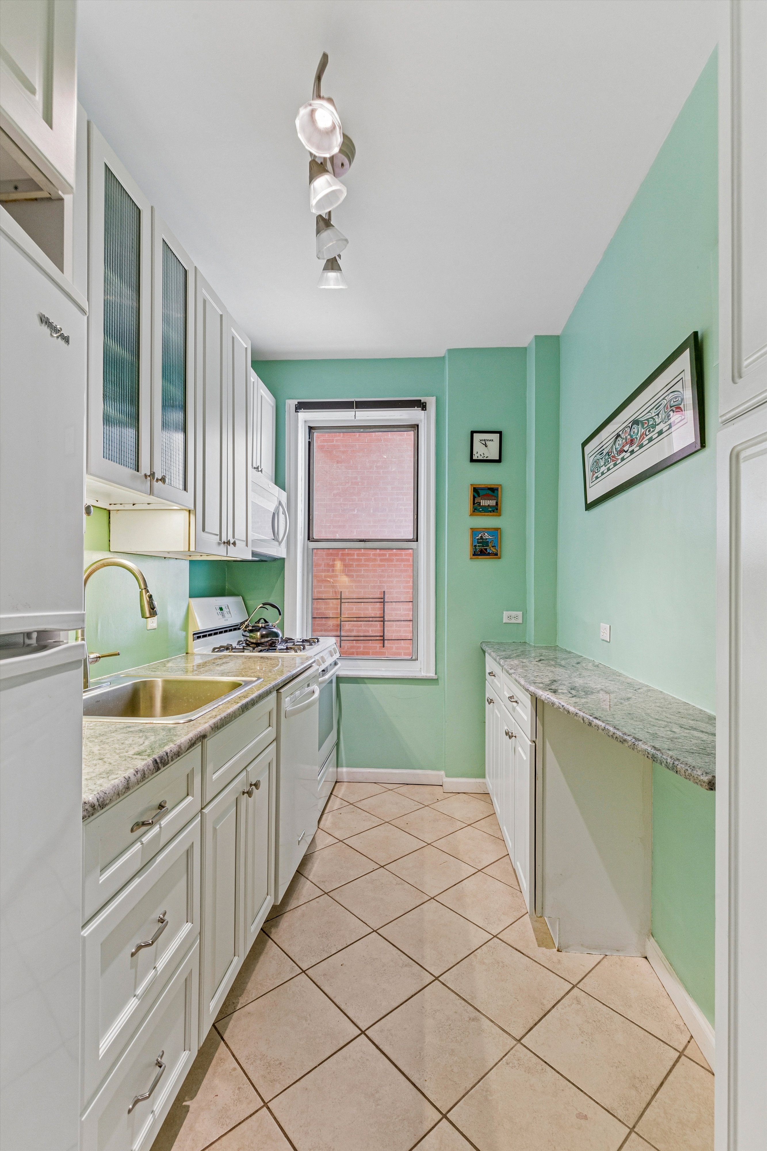 680 West 204th Street, Unit 4F Manhattan, NY 10034 - Photo 8 of 21 a kitchen with a cabinets a sink and dishwasher