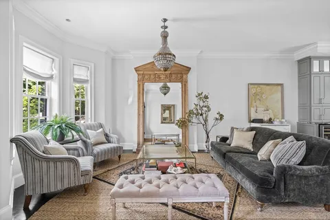 a kitchen with stainless steel appliances granite countertop a stove a sink dishwasher and cabinets with wooden floor