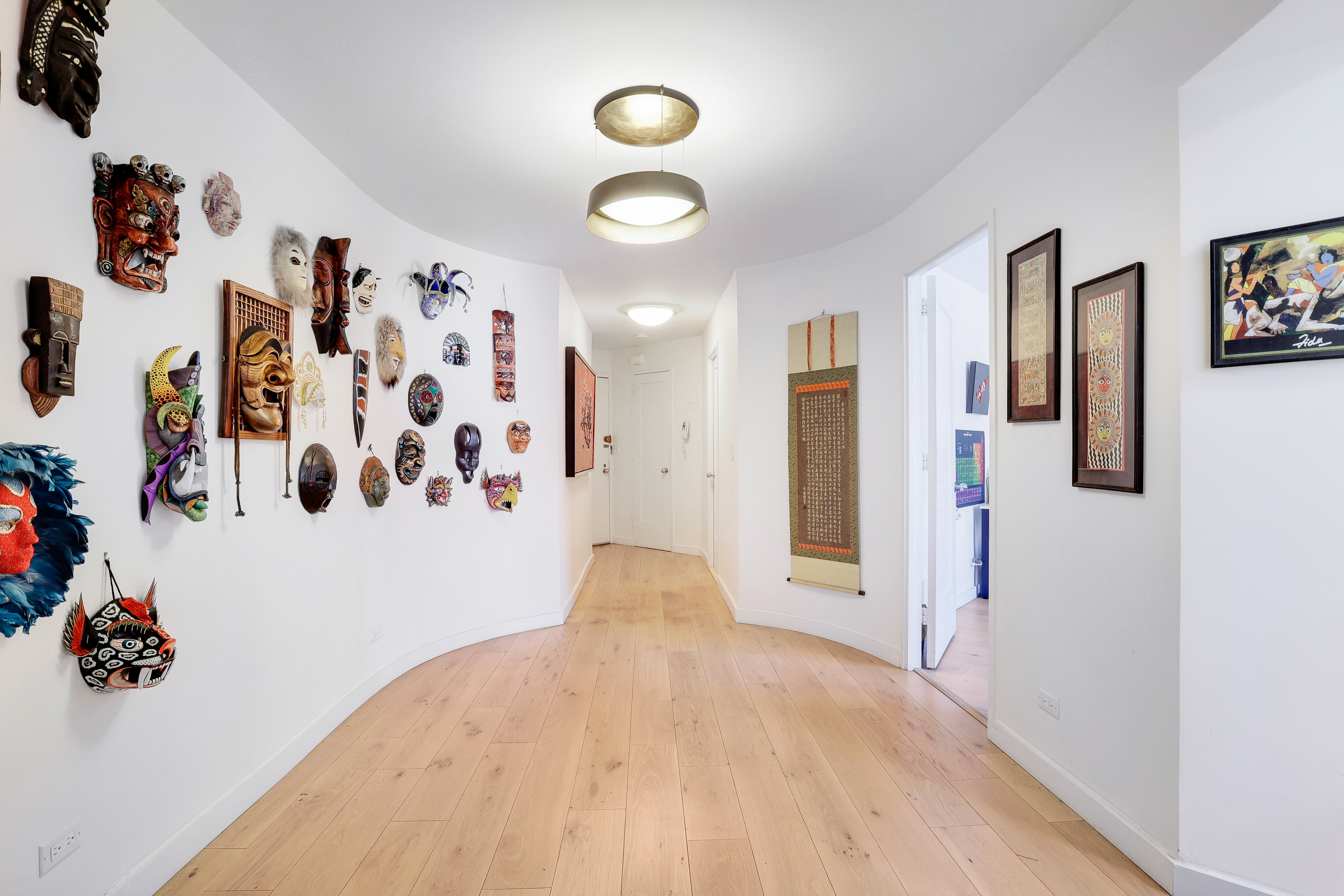 a view of a livingroom with wooden floor and closet