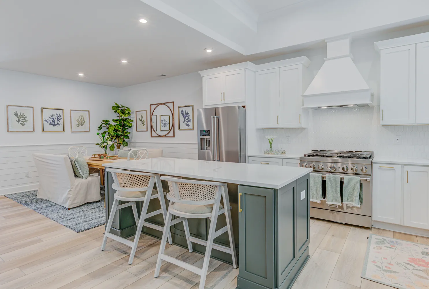 a kitchen that has a table and chairs in it