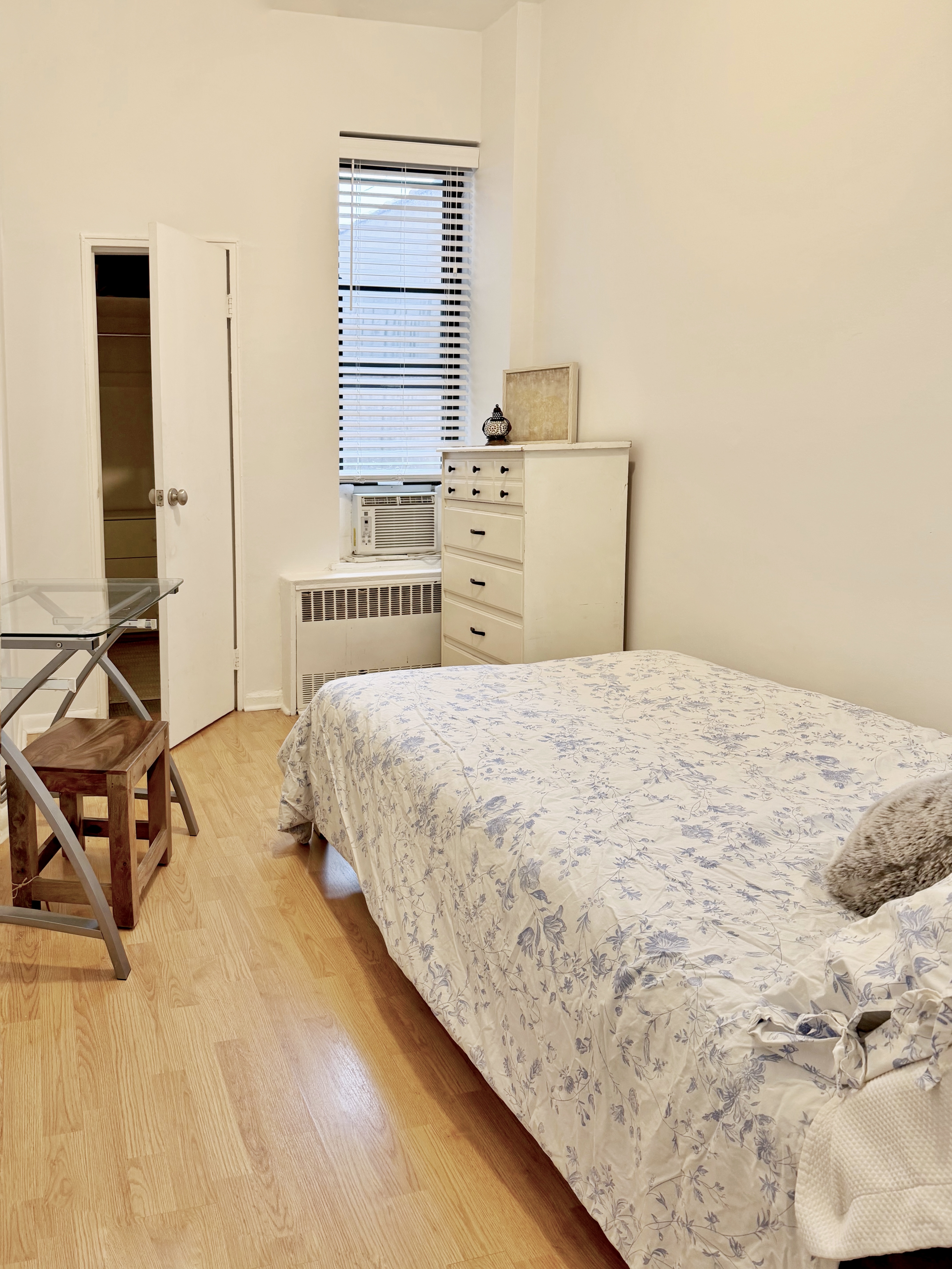 169 Allen Street, Unit 5C Manhattan, NY 10002 - Photo 5 of 11 a bedroom with a bed and a cabinets