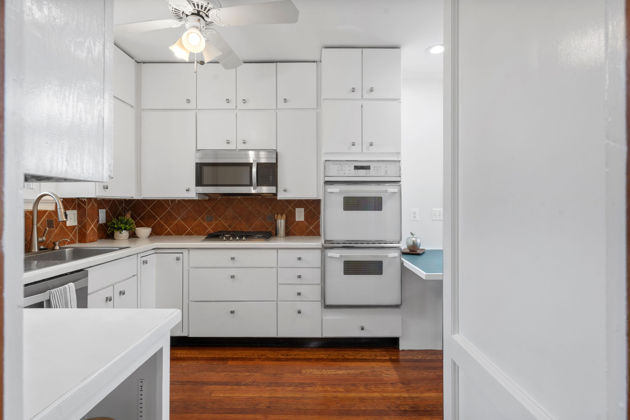 1325 Locust Road Northwest Washington, DC 20012 - Photo 18 of 56 a kitchen with stainless steel appliances white cabinets and a refrigerator