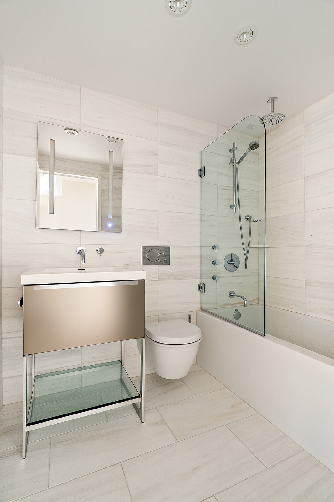 167 Perry Street, Unit 1D/2D Manhattan, NY 10014 - Photo 8 of 13 a bathroom with a sink toilet and shower