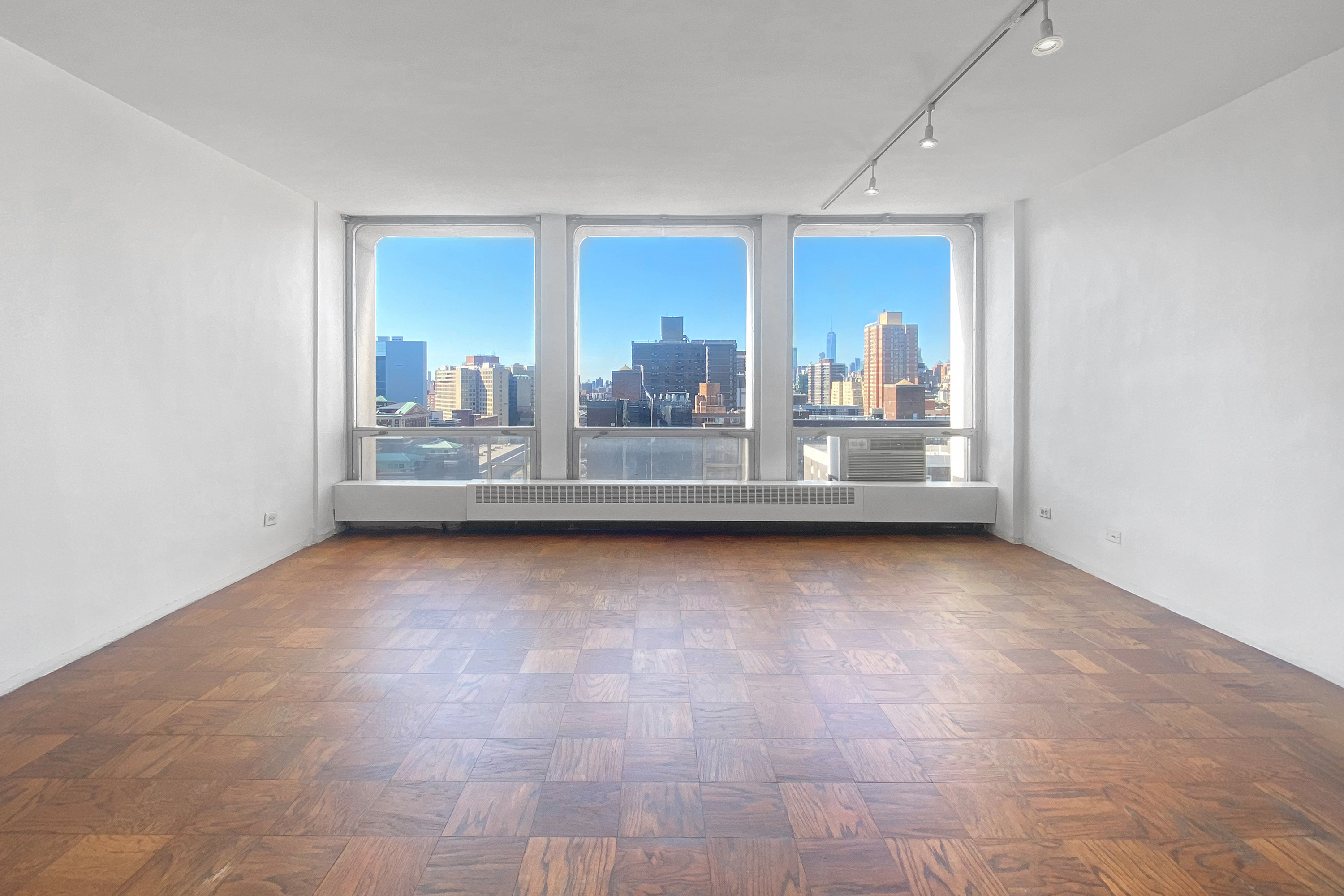 343 East 30th Street, Unit 19K Manhattan, NY 10016 - Photo 3 of 22 a view of a living room hardwood floor and a window